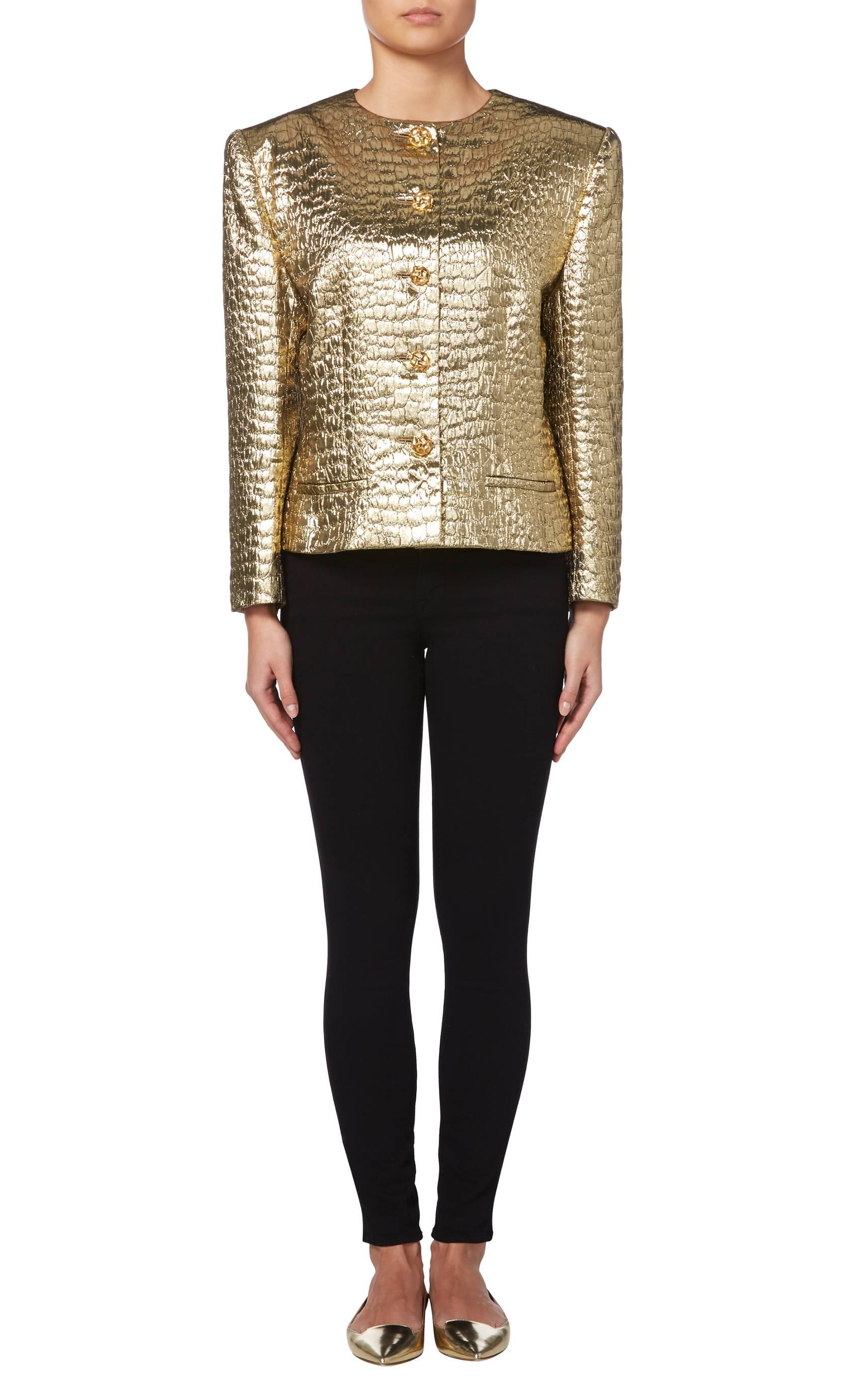 Add a touch of glamour to an evening look with the fabulous Jean-Louis Scherrer metallic gold jacket. The padded shoulders create a sharp silhouette, while textured gold buttons add extra sparkle. Team with black trousers or skinny jeans for a