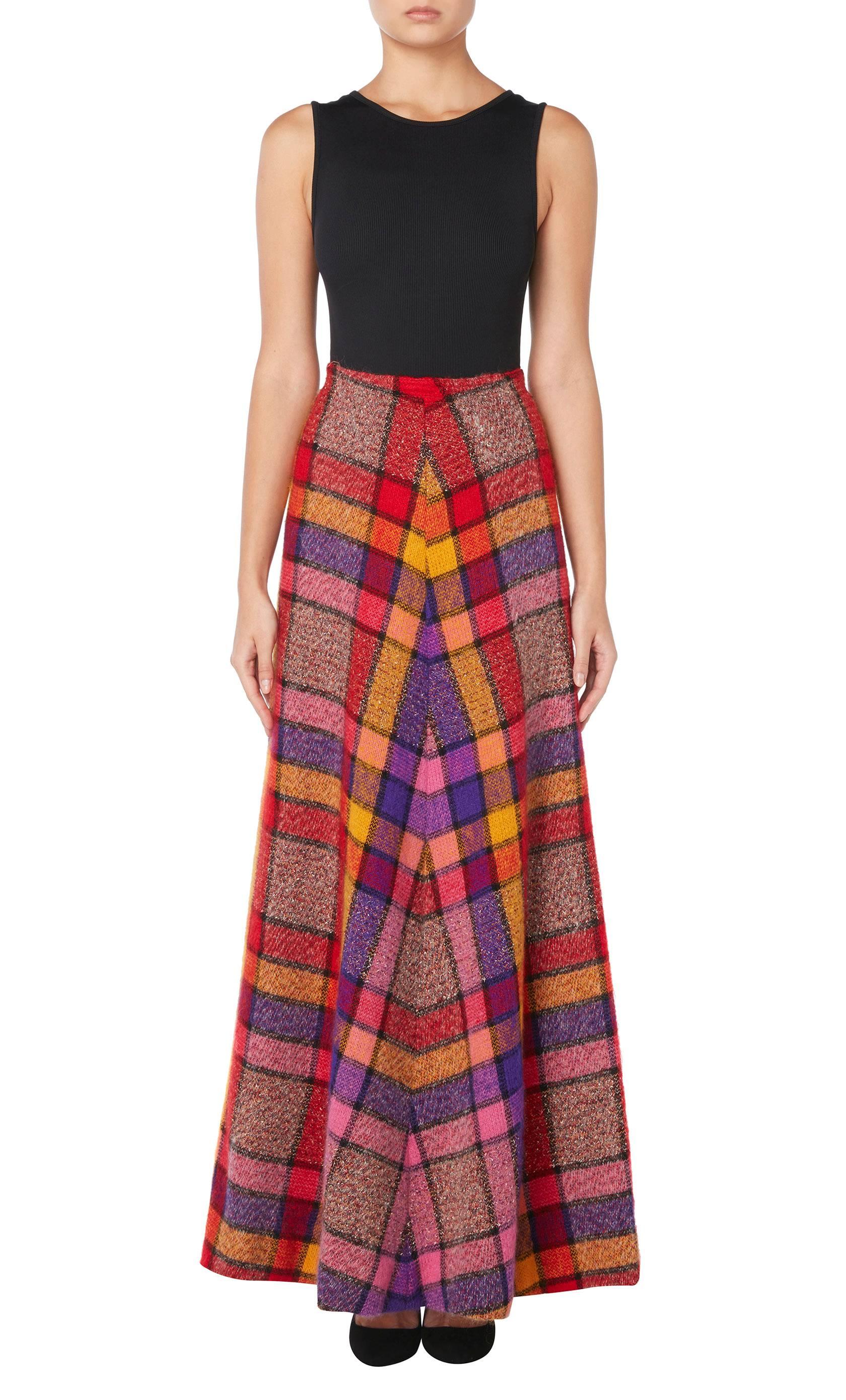 This brightly coloured Missoni maxi skirt is a fabulous example of the design house's early work. Constructed in plaid wool in clashing shaded of pink, yellow, red and purple, the skirt sits on the waist with an A-line silhouette. Perfect for