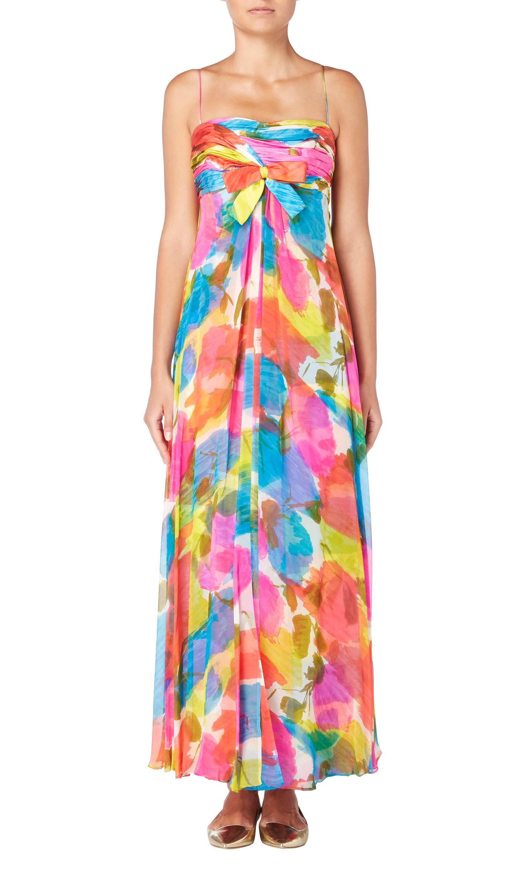 Ideal for summer cocktail parties and events, this Malcolm Starr multicoloured maxi dress is constructed from silk chiffon for a light and airy feel. Featuring spaghetti straps and gathering over the bust, the dress has a flattering empire waist