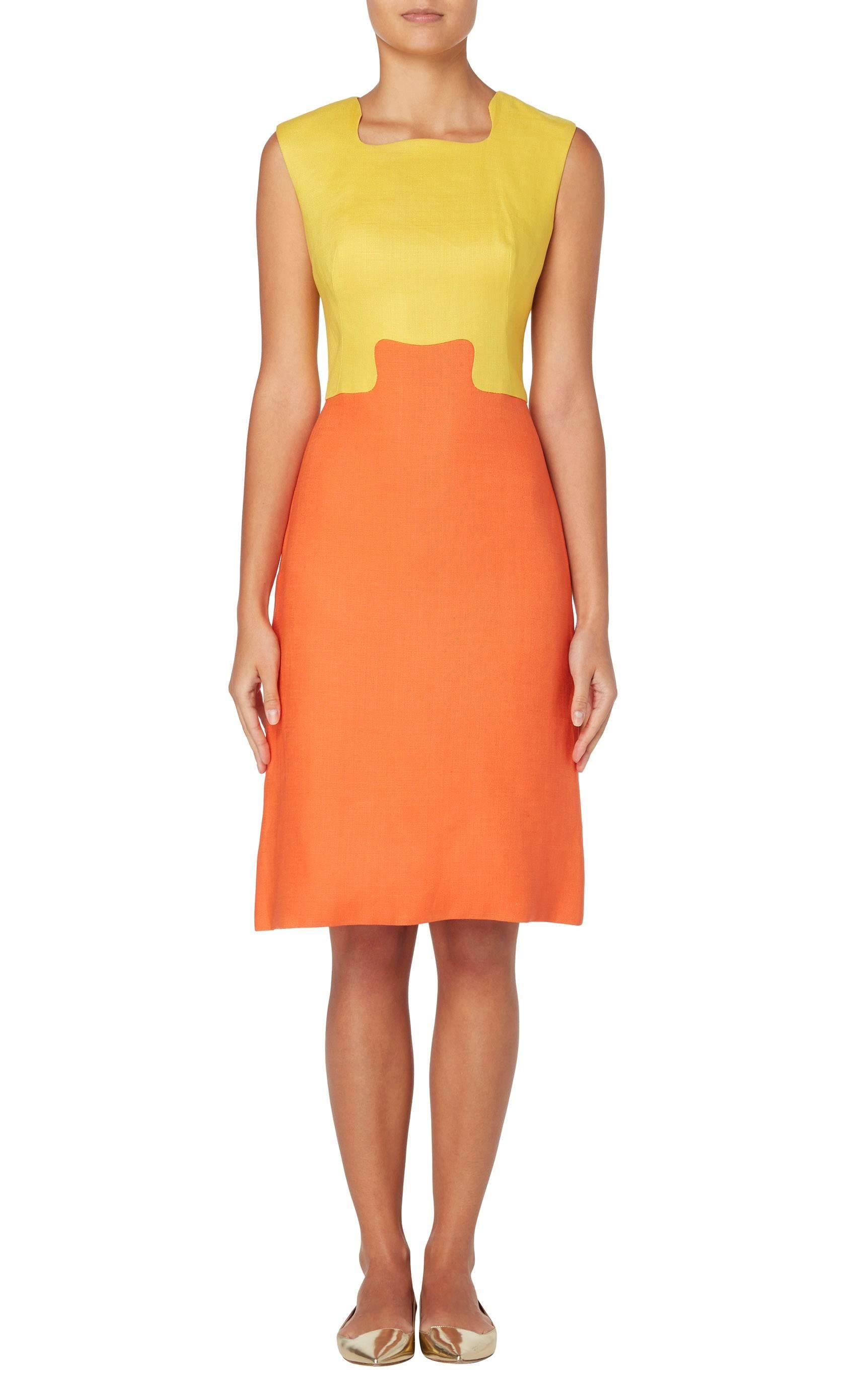 This vibrant Dynasty shift dress is a great way of introducing a pop of colour to work wear wardrobe. Constructed in yellow and orange linen, the sleeveless dress features an interlocking detail, highlighting the small of the waist.

Constructed