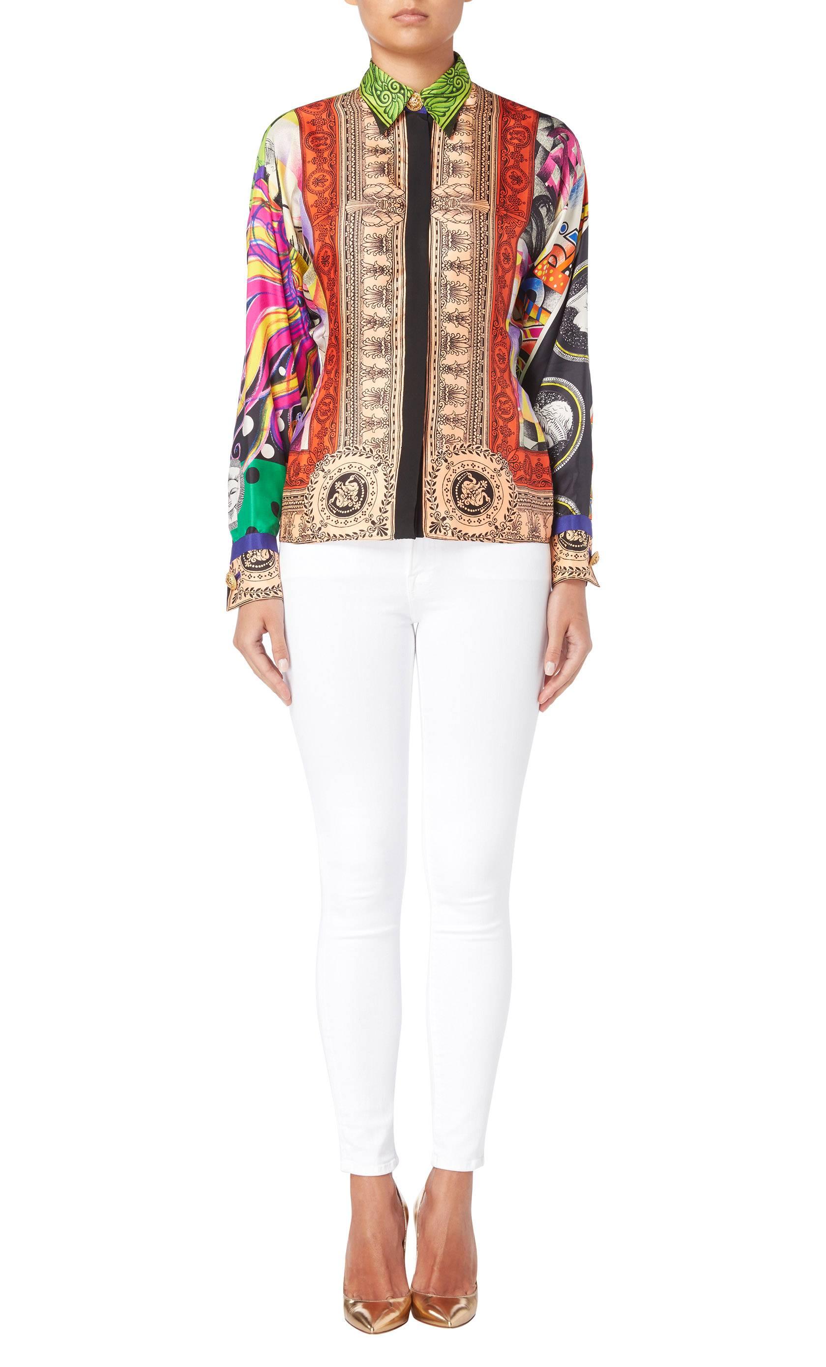 As seen on the Spring/Summer 1991 this shirt is a fantastic example of Gianni Versace’s use of vibrant colours and prints. Constructed in pure silk, the shirt has a luxurious feel and features a multicoloured print with decorative gilt buttons at