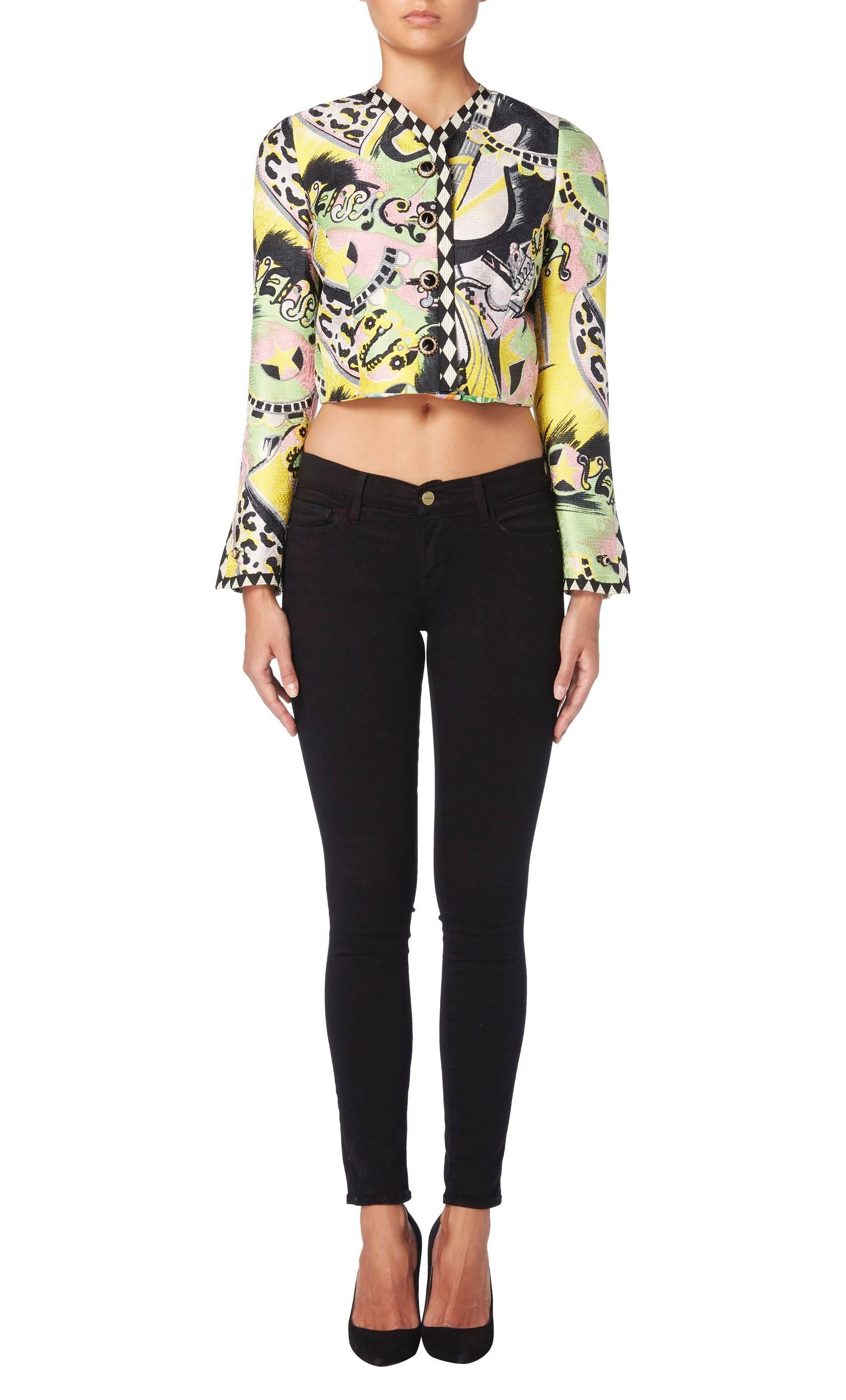 A fabulous piece by Gianni Versace, this haute couture printed jacket will add a touch of colour and fun to an outfit. Constructed in ribbed silk and featuring an abstract print in pink, green, yellow and black, the jacket has a cropped cut and long