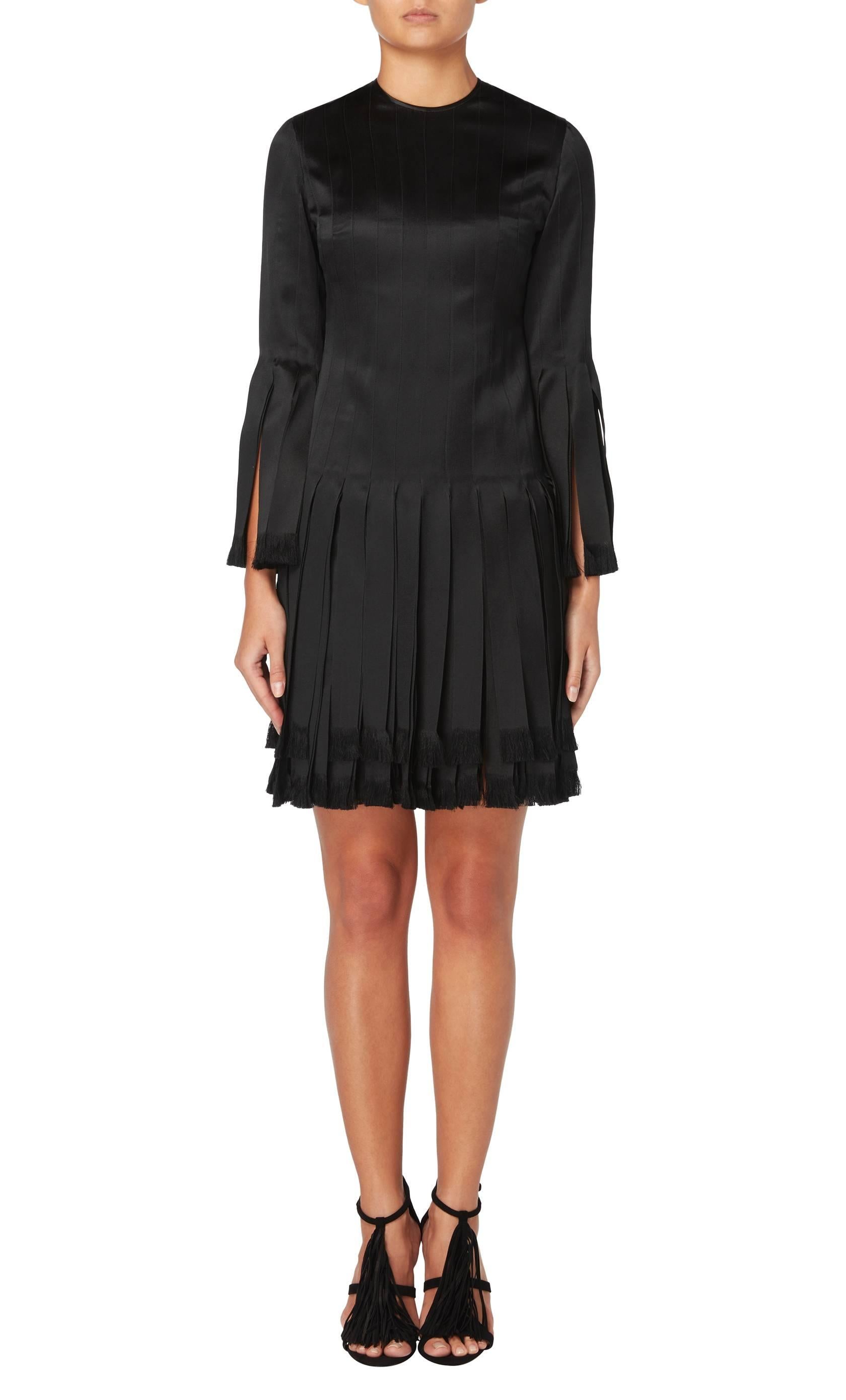 A fun twist on the classic LBD, this Galanos ‘Carwash’ mini dress is constructed in black silk and features a round neckline and three-quarter sleeves with carwash pleats to the cuffs and skirt.

Constructed in black silk
Featuring carwash