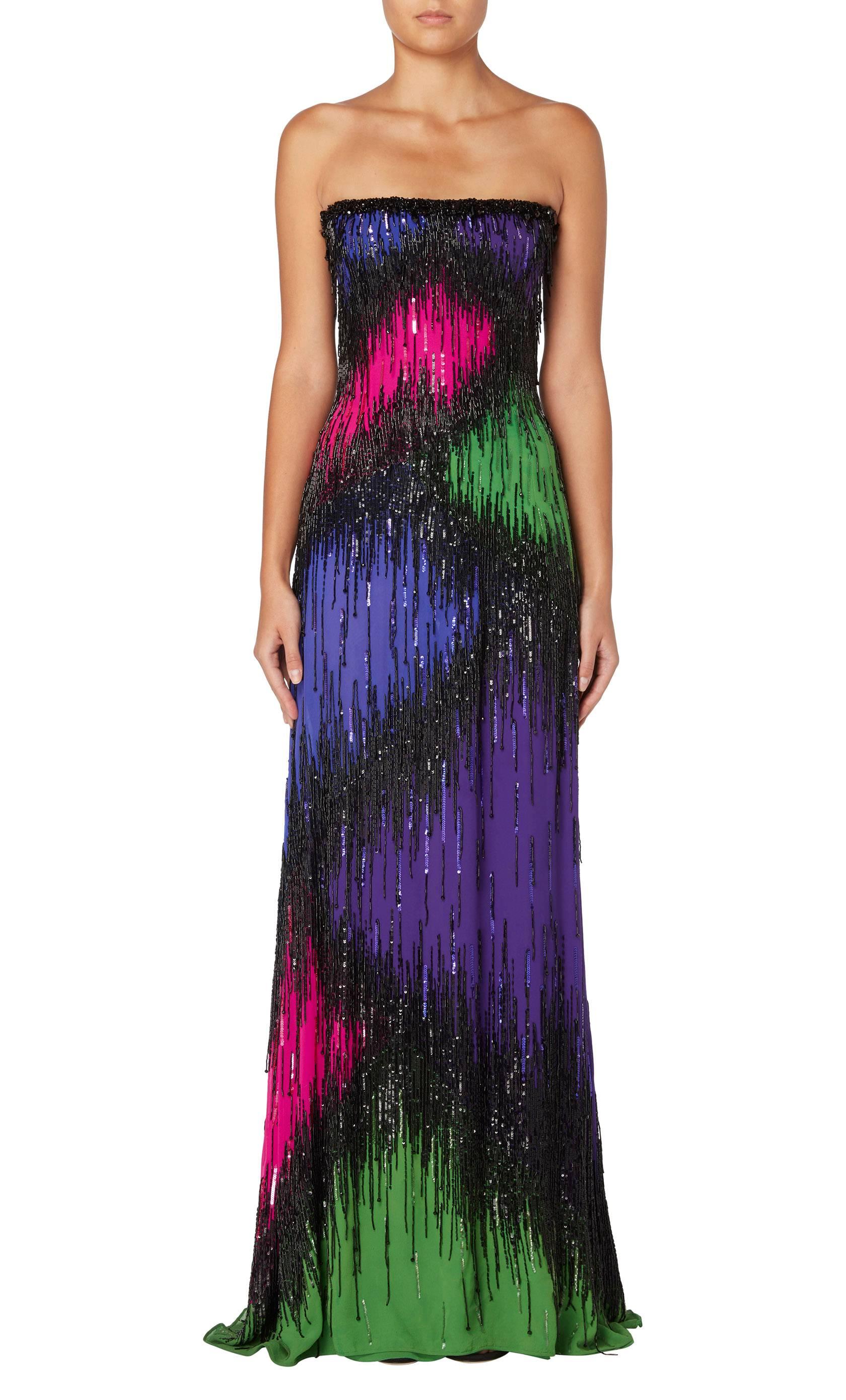 A bold evening option, this Balestra gown will be sure to make a statement on the red carpet. Constructed in bright purple, pink and green silk jersey, the strapless gown has a silk chiffon overlay embellished with black beads and sequins. With an