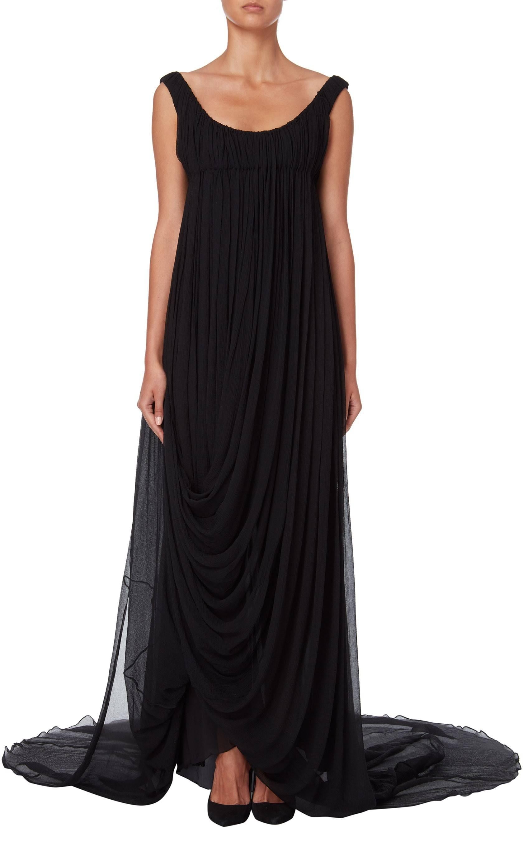 From the Winter 2008 collection of the late Alexander McQueen and a collection based upon fantasies of his ancient country garden. This dress is constructed in fine black silk with a low neckline and slightly off-the-shoulder straps, the fabric of