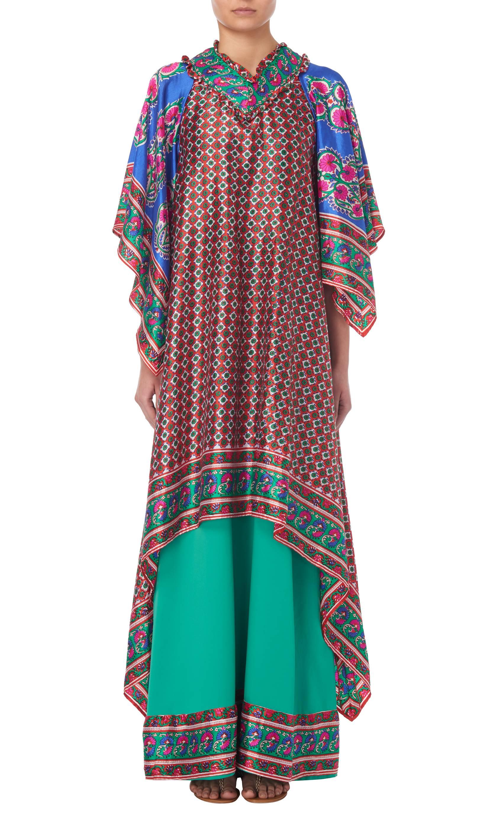 Multi-coloured silk printed tiered kaftan by English design house Belville Sassoon, circa 1971. The tiered kaftan features an all-over print and ruffle detailing to the collar.