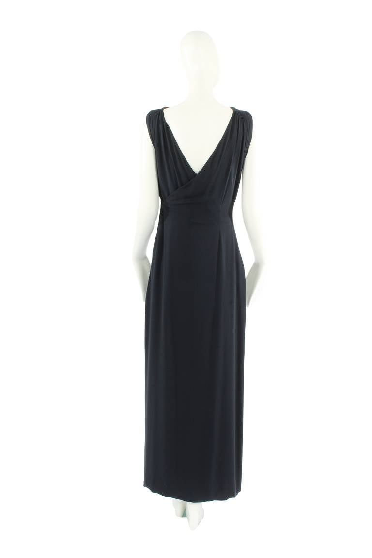 A fabulously chic dress by Paquin, the legendary French haute couture house, this is a wonderfully wearable dress ideal for a Black Tie event. Crafted in black silk crepe, the dress is a beautifully-cut, well-shaped piece of haute couture sold