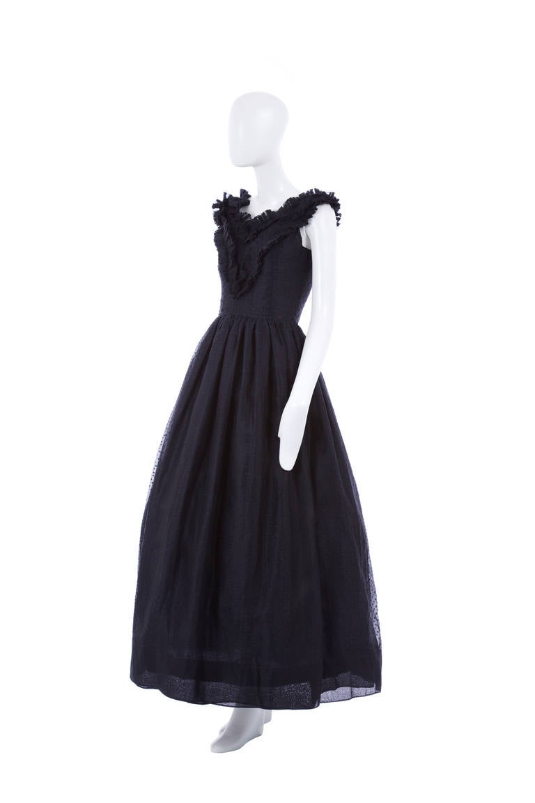 An exceptional Dinner length dress by Lanvin, this beautiful piece is constructed in pure black silk organza with raised spot detail throughout. In superb condition, the dress creates a wonderful shape when teamed with a tulle and features layered,