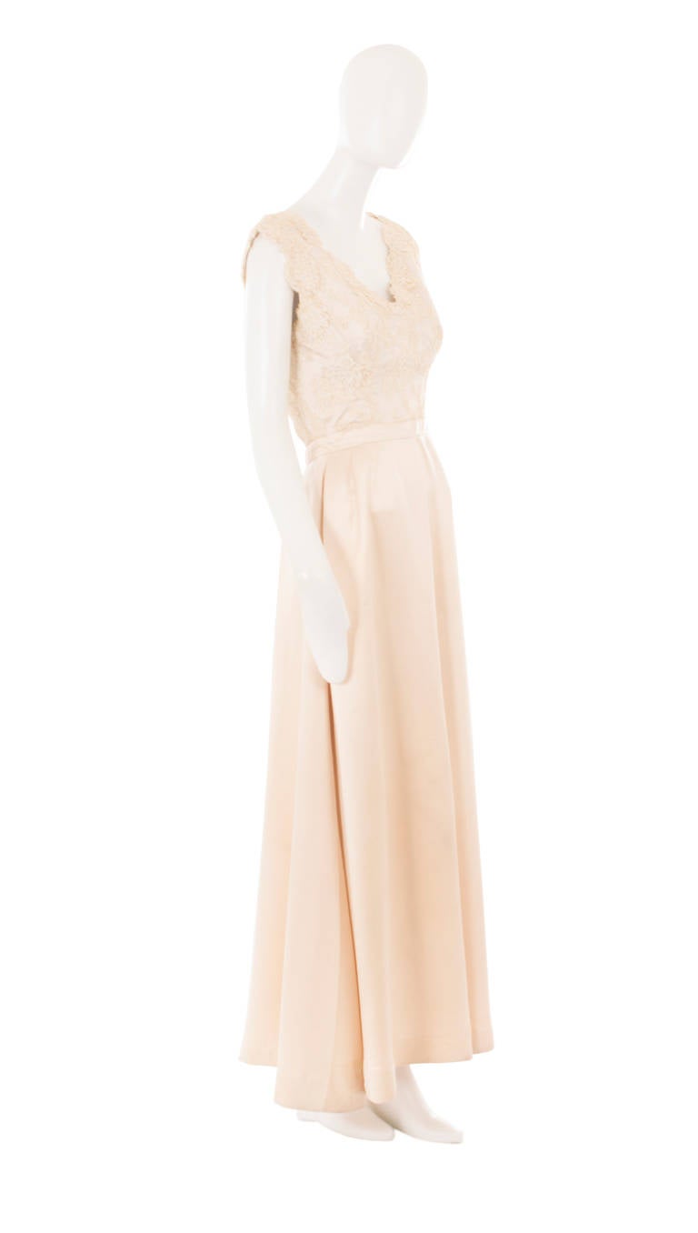 An exceptional two piece dress and a superb example of mid-century Balenciaga; so much so, that you will find several similar examples within the MET Collection in New York. Perfect for a Black Tie event or a chic city bride, this wearable