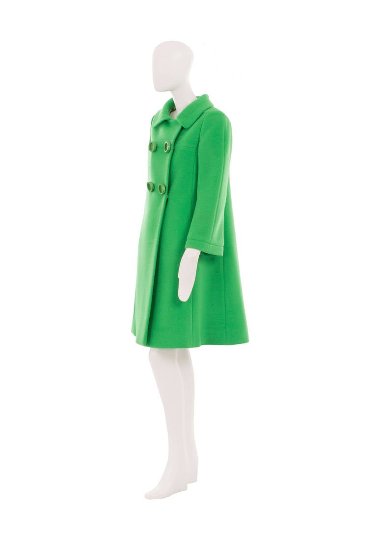 A great way of injecting some colour into a winter wardrobe, this amazing Guy Laroche couture coat will really make a statement. Constructed in apple green wool, the classic 1960s cut creates a flattering A-line silhouette. The collar and inside