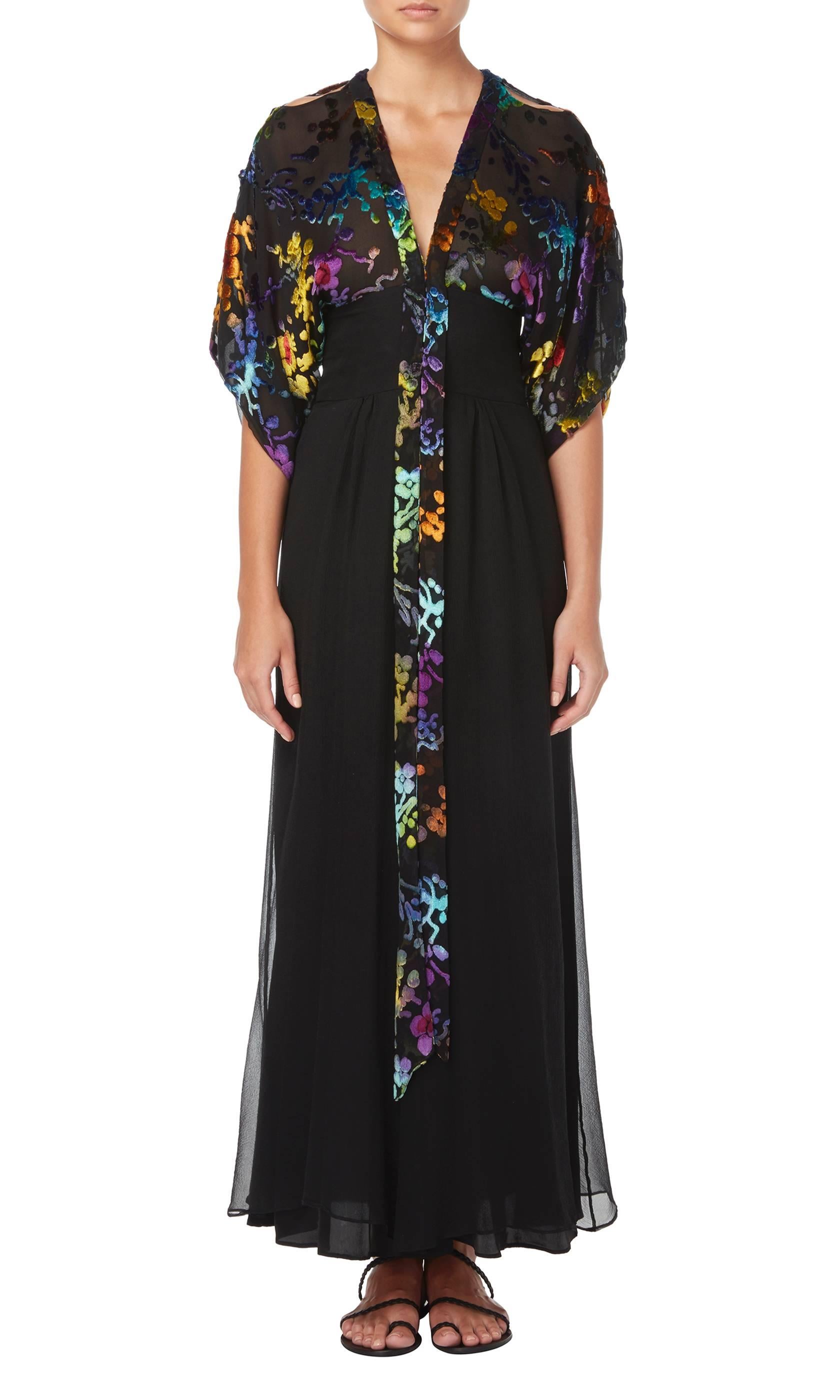 A beautiful piece of Thea Porter couture, this dress is a stunning option for a cocktail party. The bodice of the dress features a rainbow floral pattern in devor̩é, while the wide sleeves are split from the shoulder to reveal the arm. The skirt is