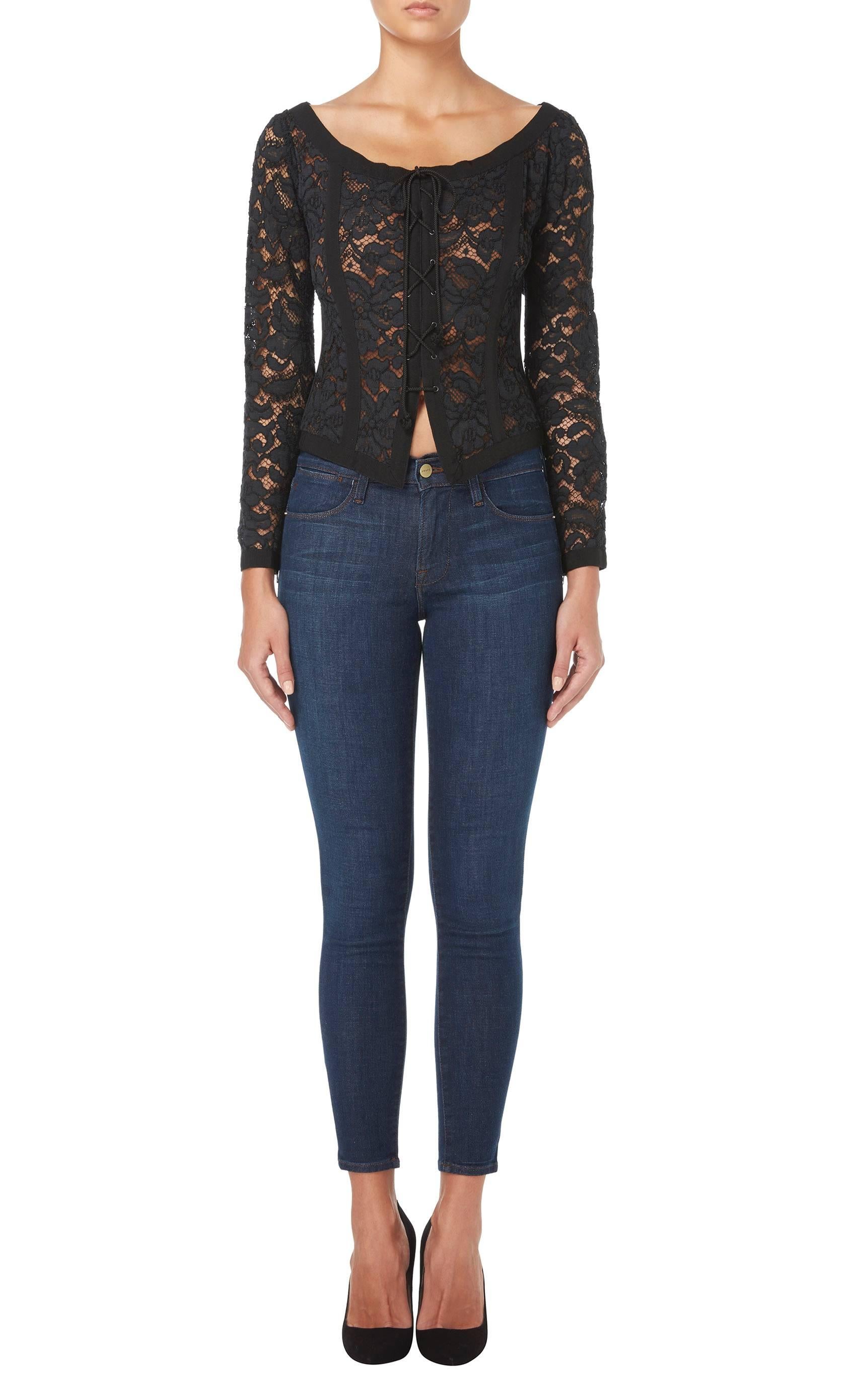 This Yves Saint Laurent bodice is an amazing piece of eveningwear, whether teamed with a pair of slim fitting trousers or a skirt. Constructed in sheer black lace with a nude lining in the body for opacity, the bodice features a flattering scooped