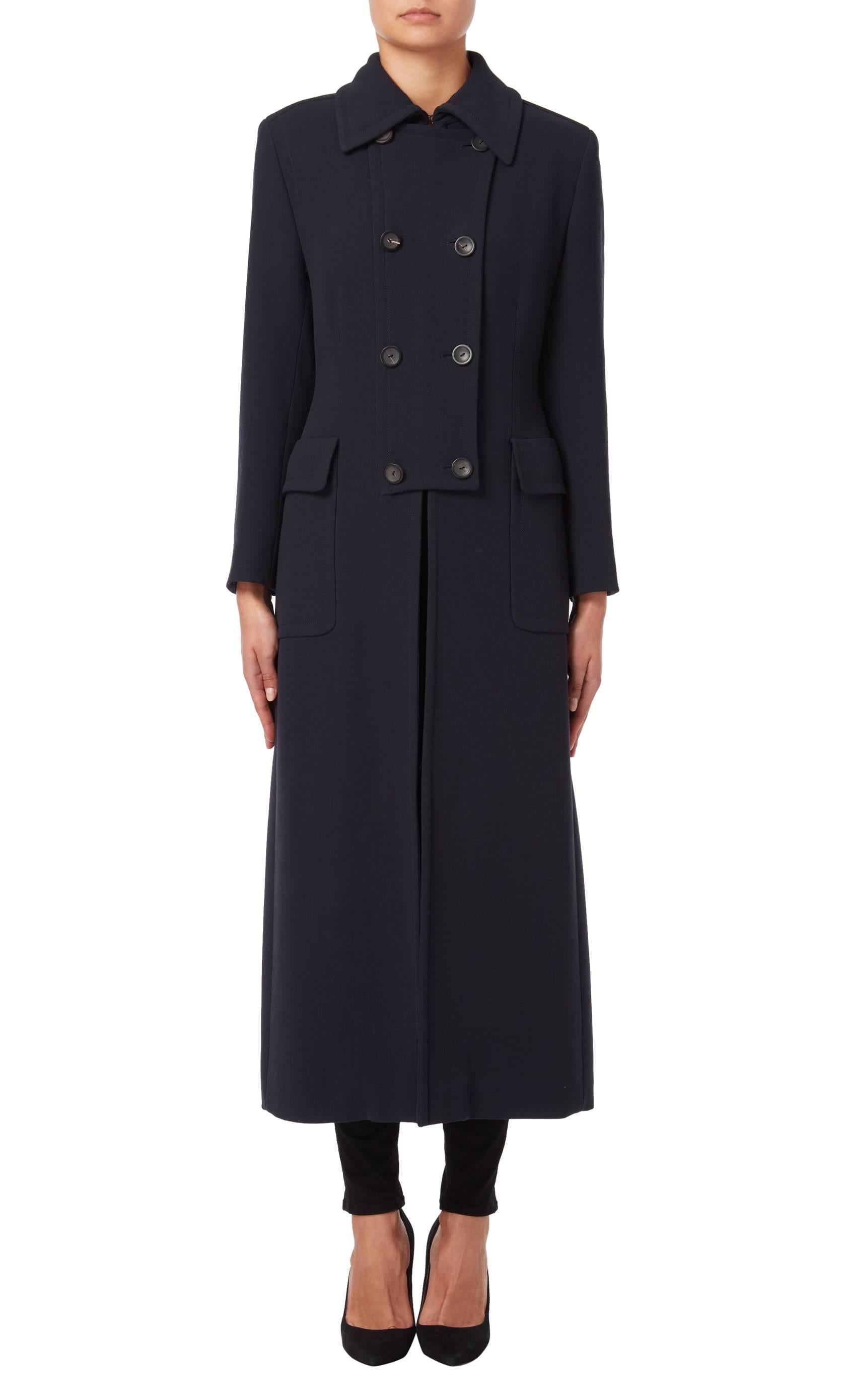 Navy military inspired overcoat by Tom Ford for Gucci from the Autumn/Winter 1996 collection. The coat features a silver metal clip detailing to the back, embossed with the Gucci logo. The coat is constructed of   wool with Zip fastening to the