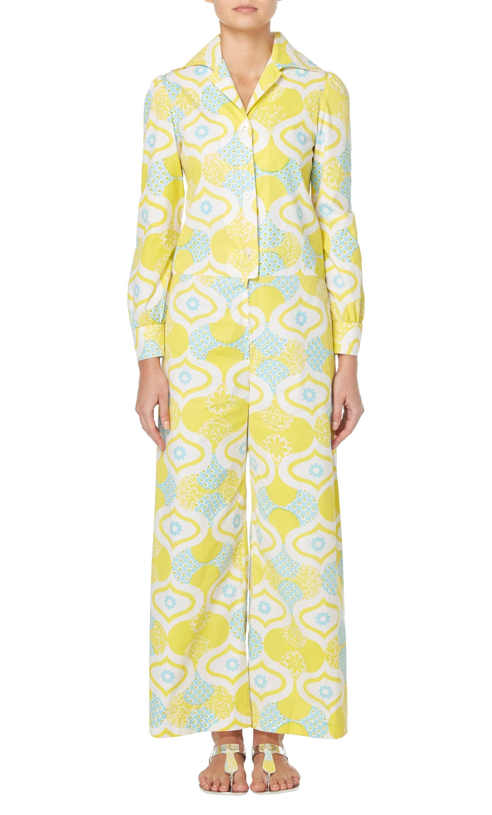A fantastic piece of fashion history, this jumpsuit is from the 'Twiggy' line, created by the famous model in the 1960s. Constructed in cotton, the jumpsuit features an ivory, blue and yellow geometric print, making it the perfect alternative to a