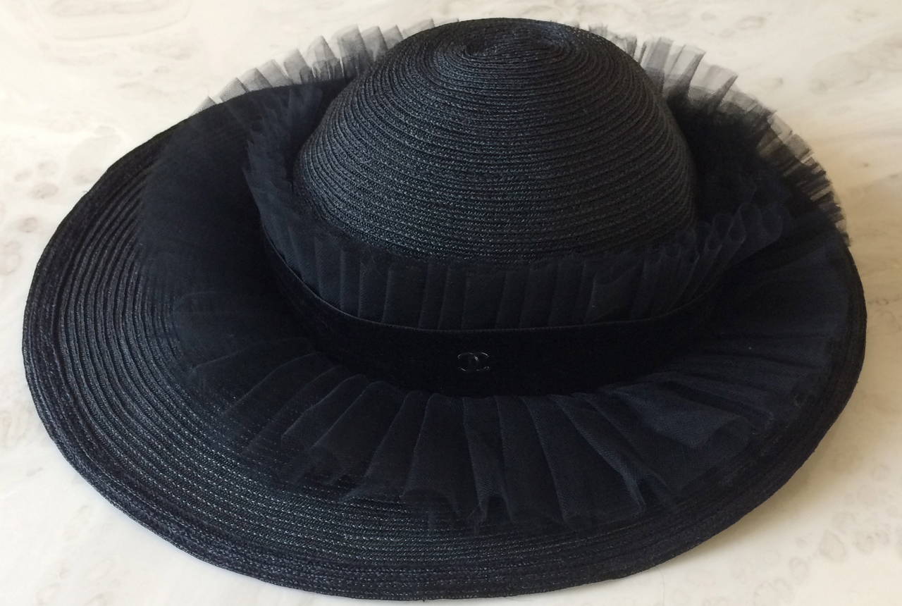 This  Divine Chanel hat is from the Spring of 2003. This hat walked the runway, was featured in Chanel advertisements and fashion editorials. Now available for you. Fabulous pleated tulle details surround the hat. The inside  lining of this hat is