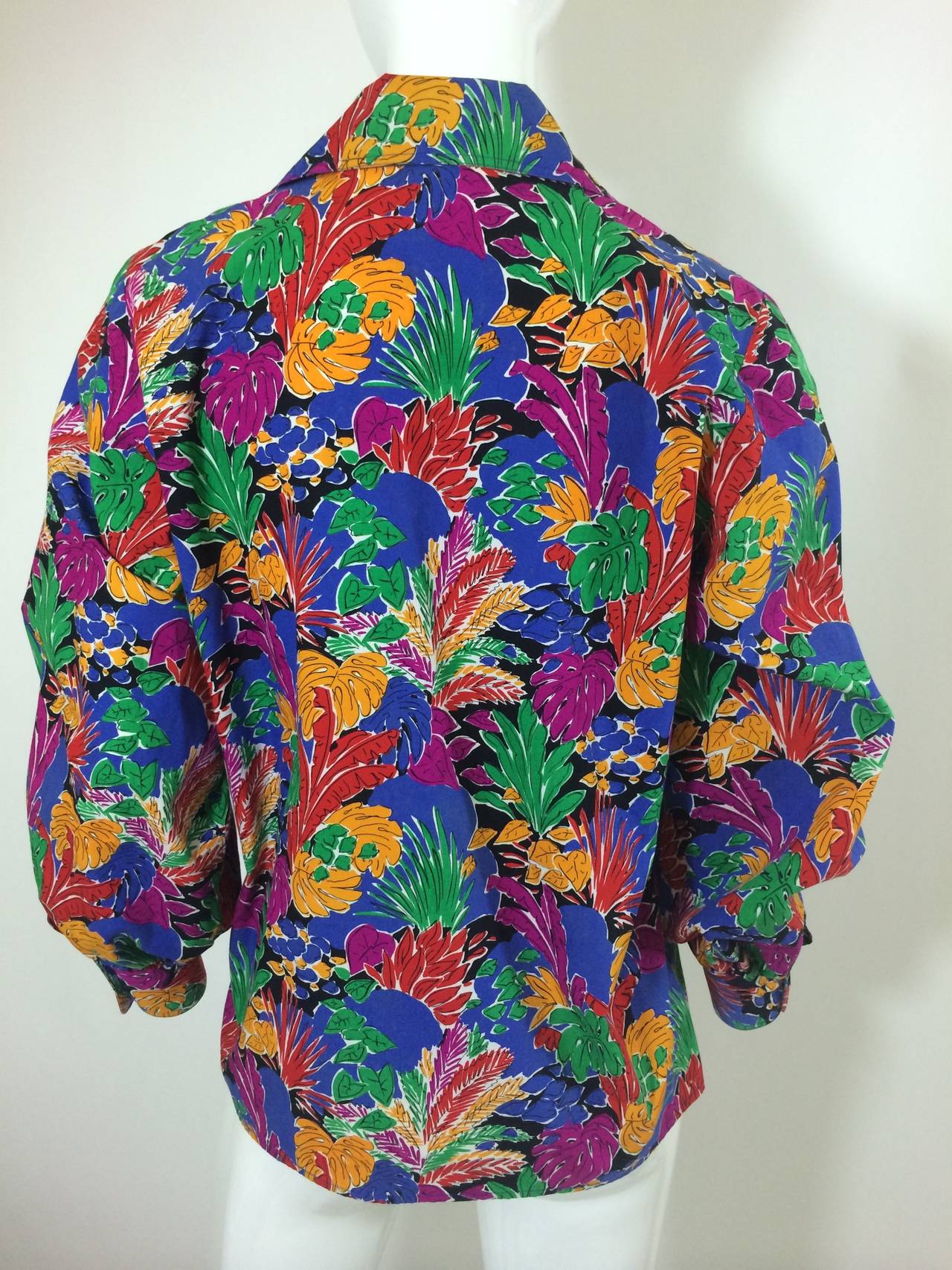 A vintage Yves Saint Laurent, cotton blouse with a colorful Matisse inspired 
print. This top is fashioned from a crisp cotton featuring full sleeves, open neck, three  button front closure. 
Size 36.
Excellent condition