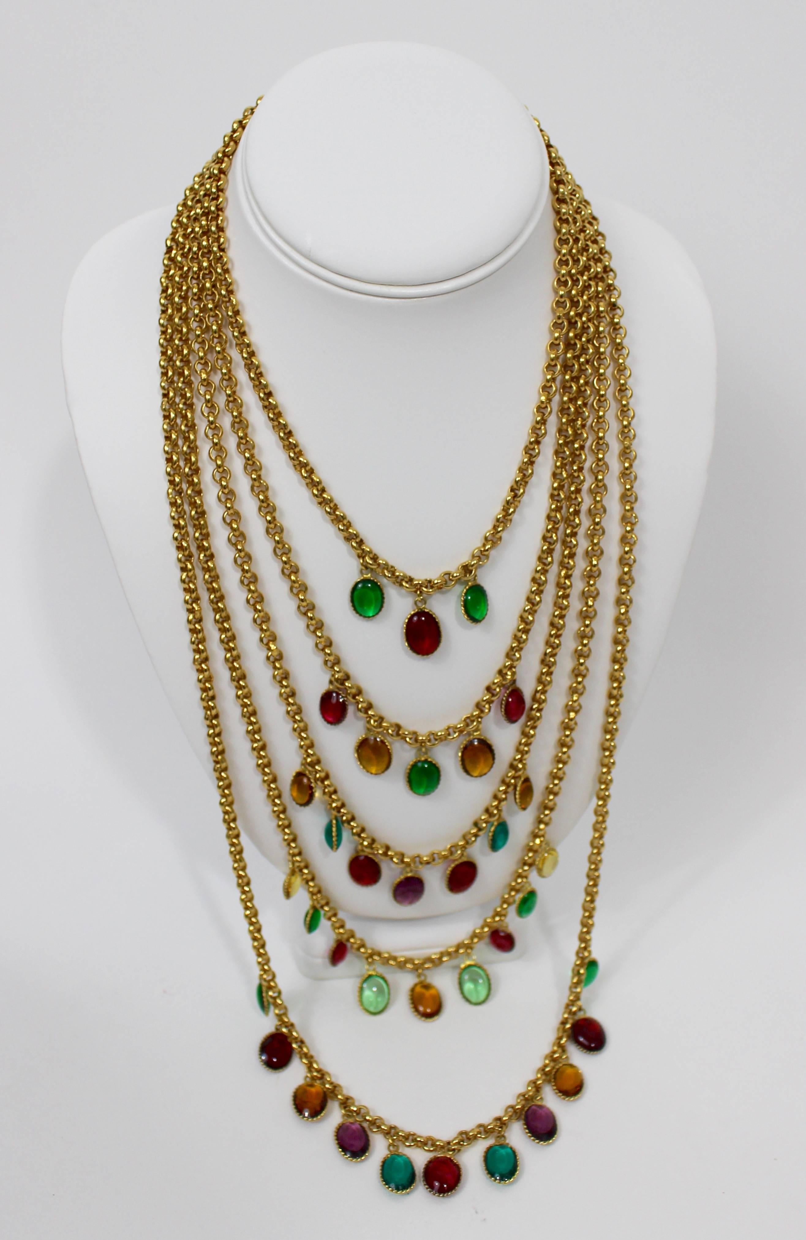 Vintage Chanel Gripoix pate de verre dangling bead necklace. .
Made of five strands of mini gold chain links with oval pate de verre poured glass Gripoix beads dangling from each chain. 

Measurements:
Necklace length: 
Shortest strand: 15