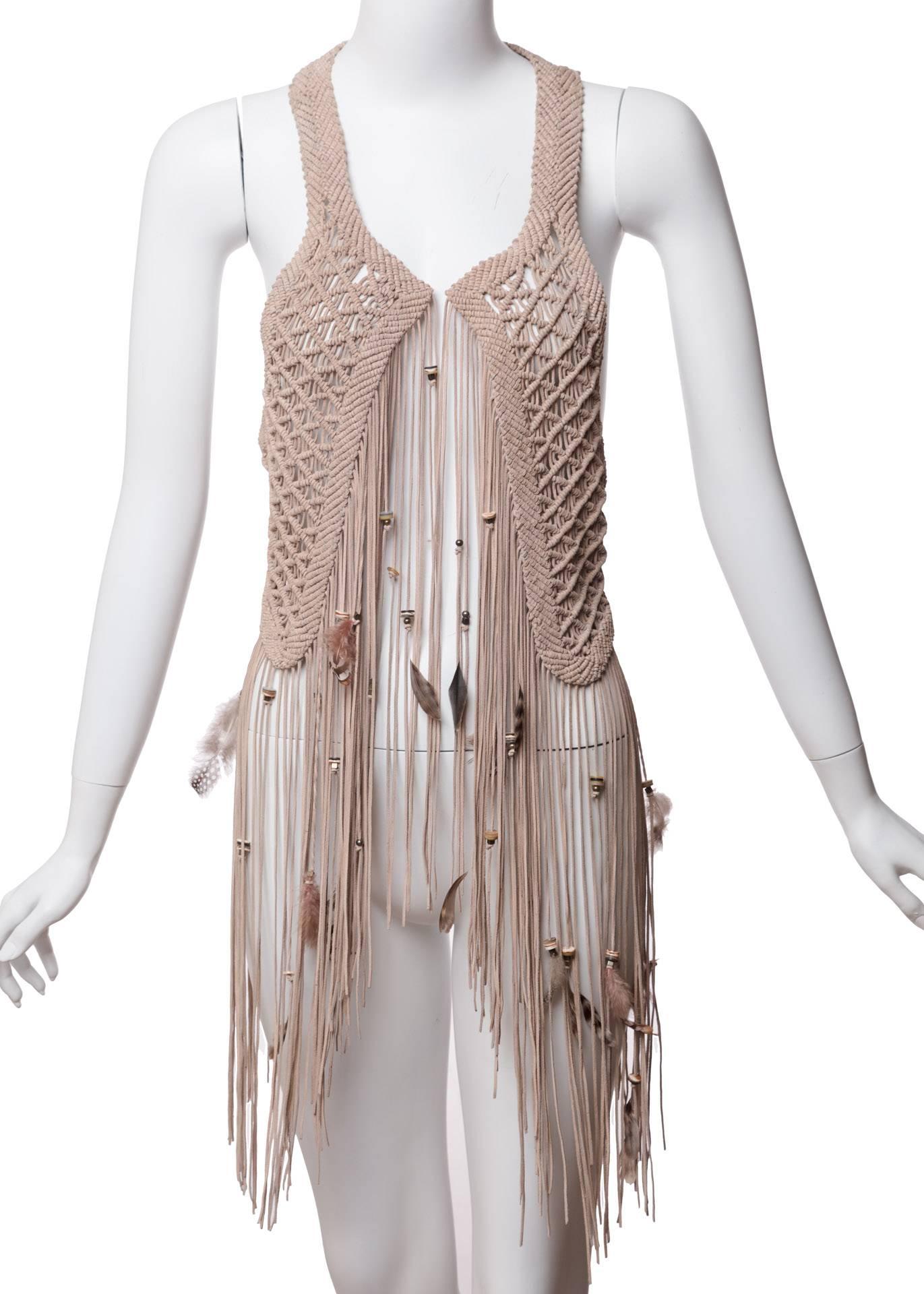 A gorgeous buttery soft fawn leather is exquisitely knotted to make this stunning macramé vest by Roberto Cavalli. Part of the Florentine designer’s 40th anniversary collection—“with the whipstitching, lacing, and patchworking reaching new heights,”