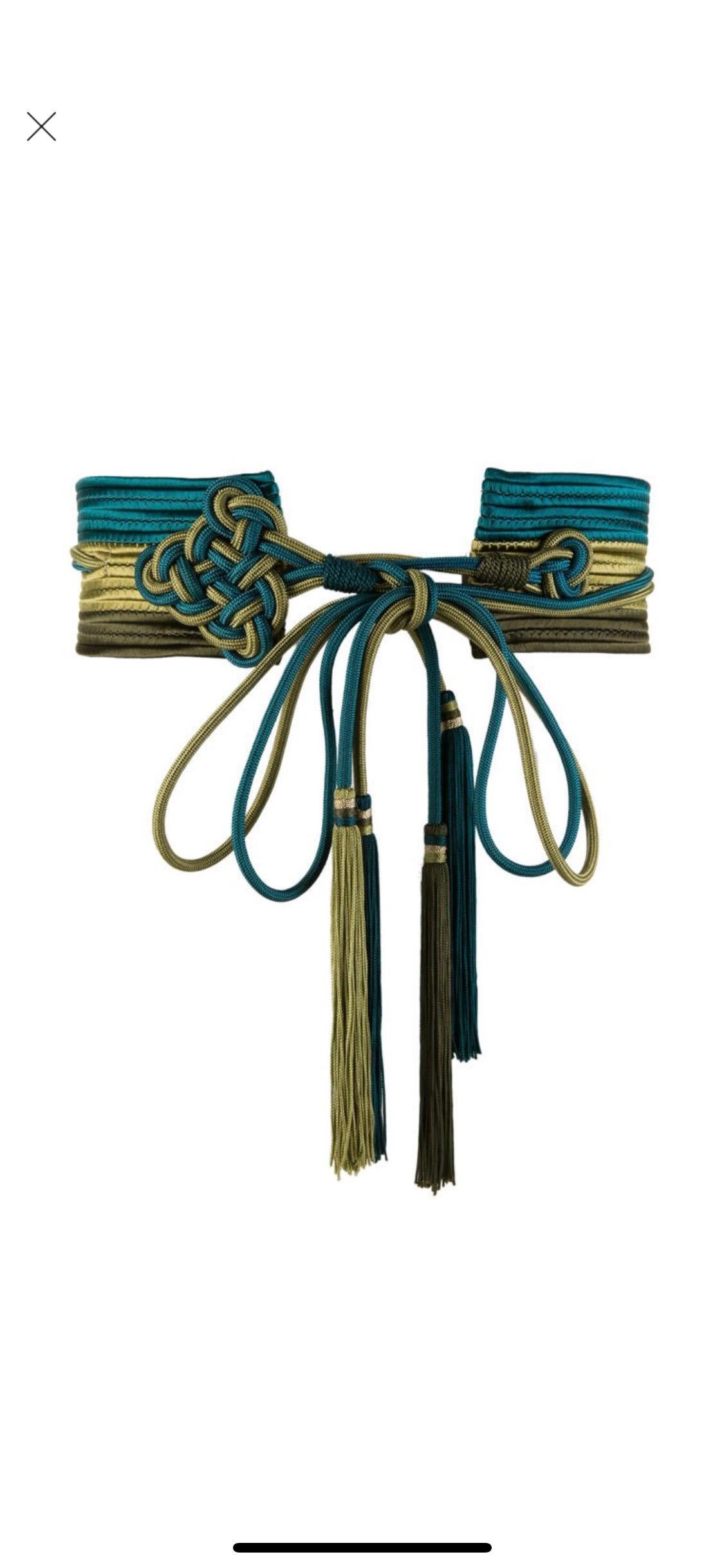 The suit, the safari jacket, the peasant dress—Yves Saint Laurent was a master at seeing the high-fashion potential of that which others might have dismissed. This passementerie belt is an example of his design genius. Passementerie, the art of
