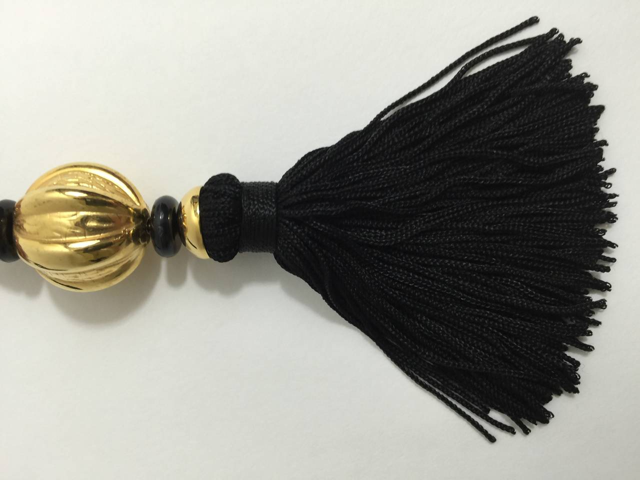 Yves Saint Laurent Vintage Opium Pendant & Gold Bead Black Tassel Necklace In Excellent Condition For Sale In Boca Raton, FL