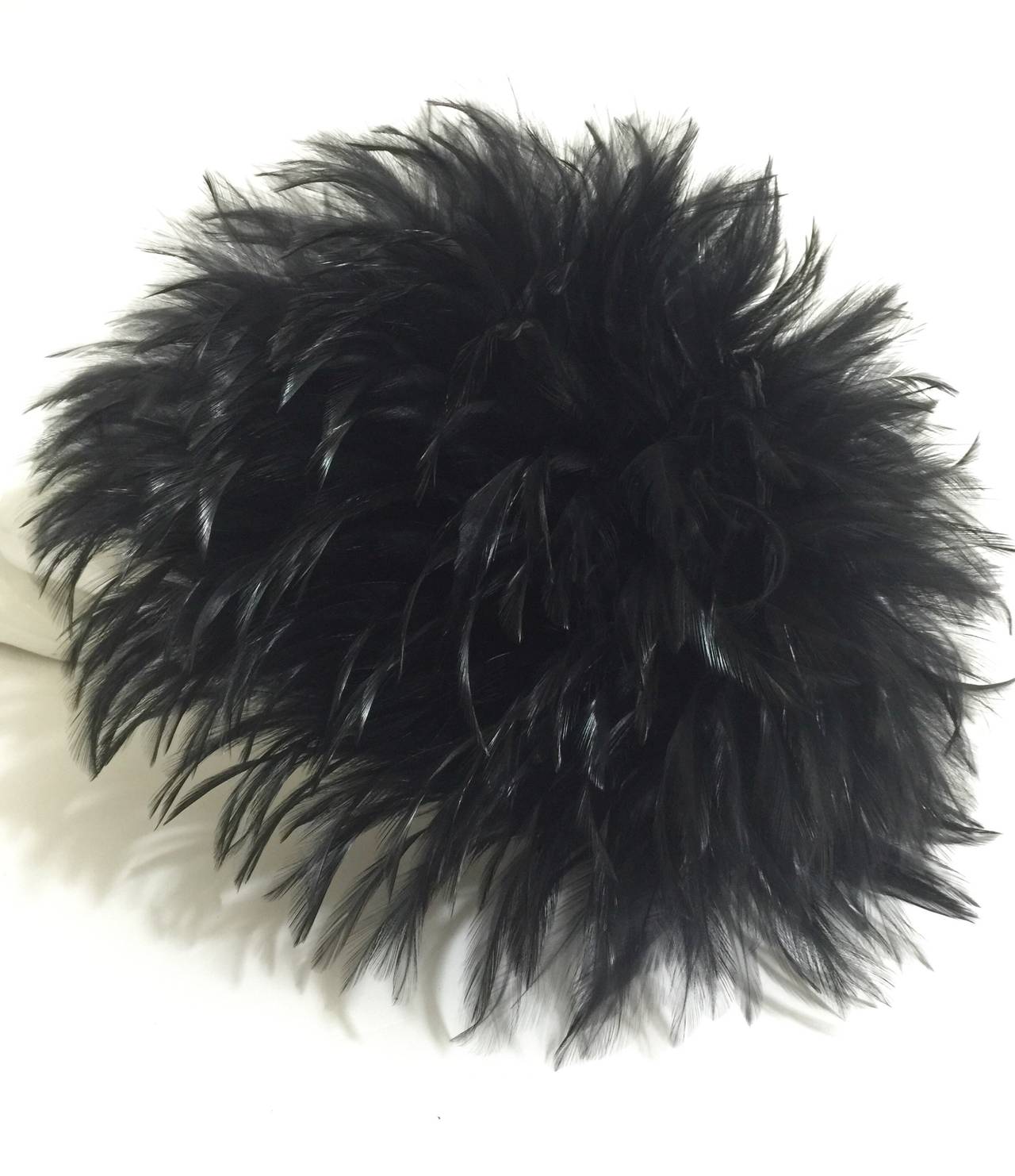 The height of chic is this magnificent Chanel hat  covered in black feathers. The feathers move and sway with you. Lined in satin.
In mint condition with Chanel tags.