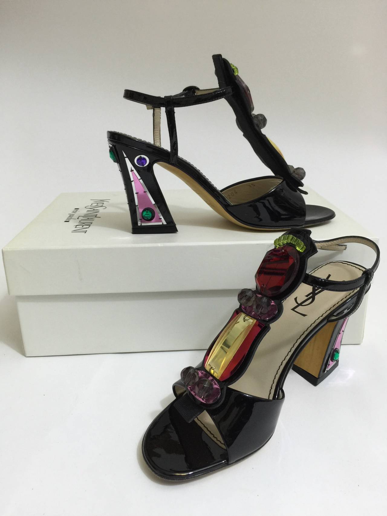 A Gorgeous pair of black patent leather T-strap sandal with jeweled details in plexi and sequins. From the spring 2008 collection
Gently worn
4 heel. 
size: 35/5
Made in Italy