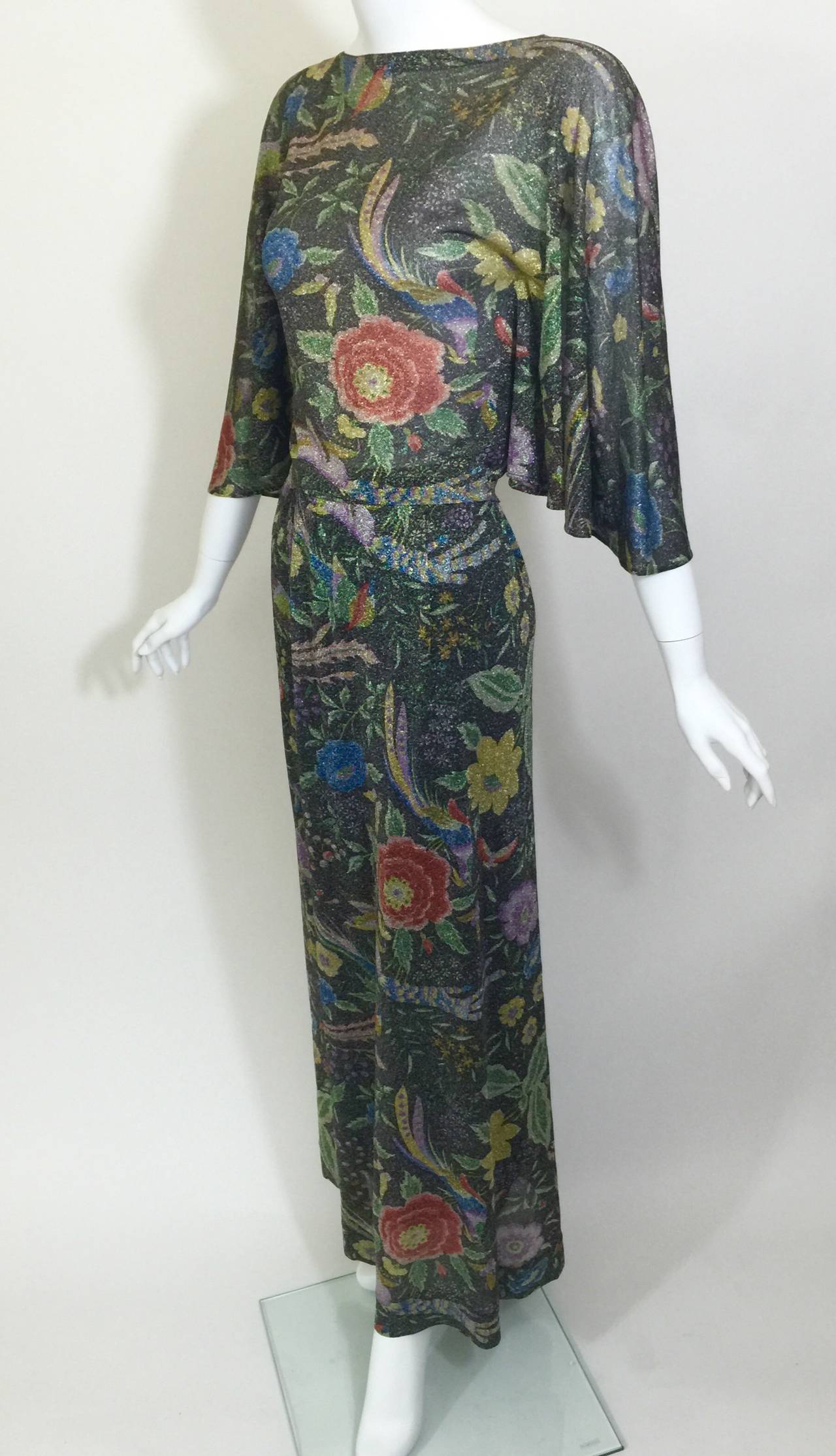 This is a very rare Missoni ensemble from the 1970s. The fabric is a super fine metallic lurex.
The print of birds flowers and butterflies is one of my favorite Missoni prints.
The top features an angel sleeve, and is paired with a maxi skirt