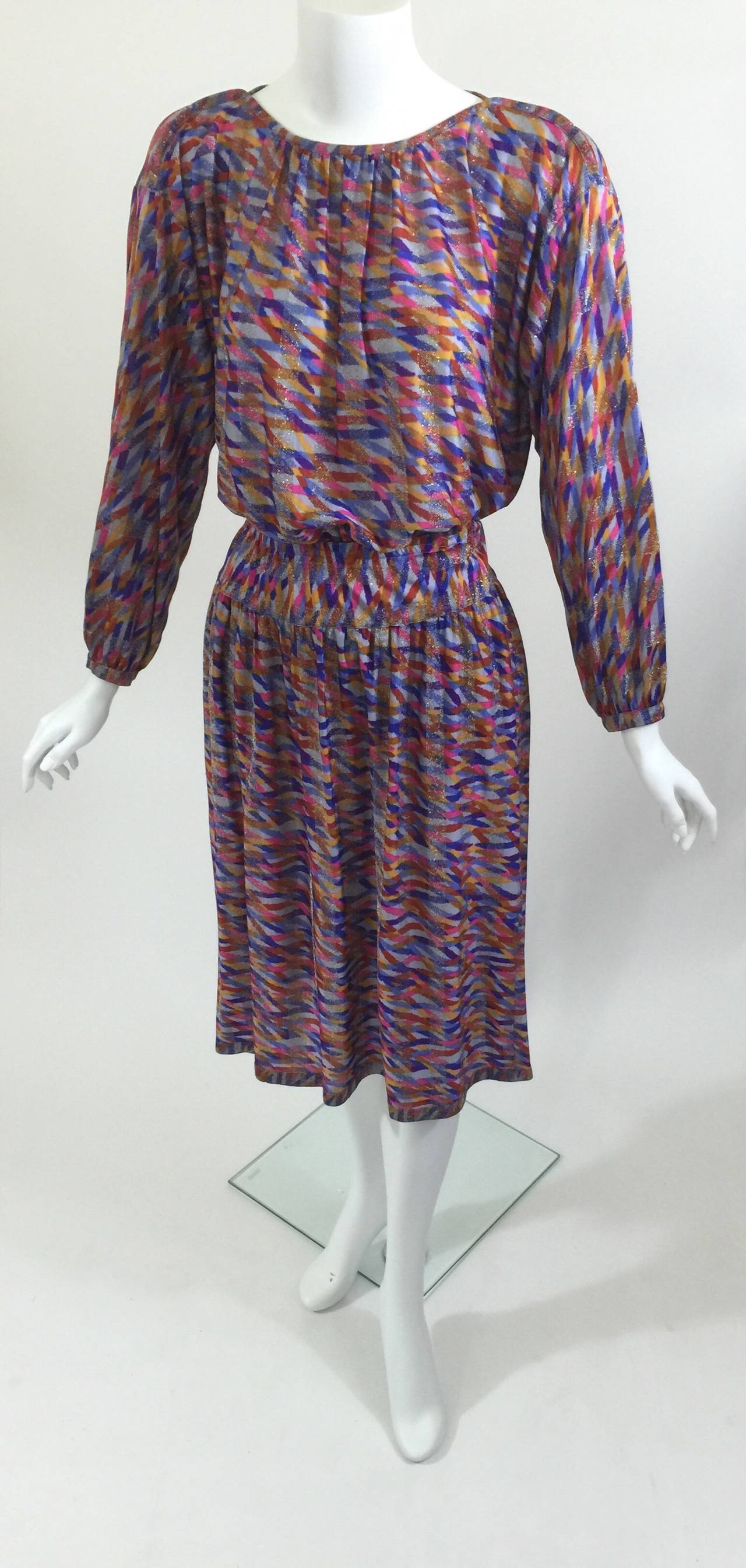 Divine silky Missoni blouson top with a matching midi skirt. 
Multi- Color metallics with silver threading.