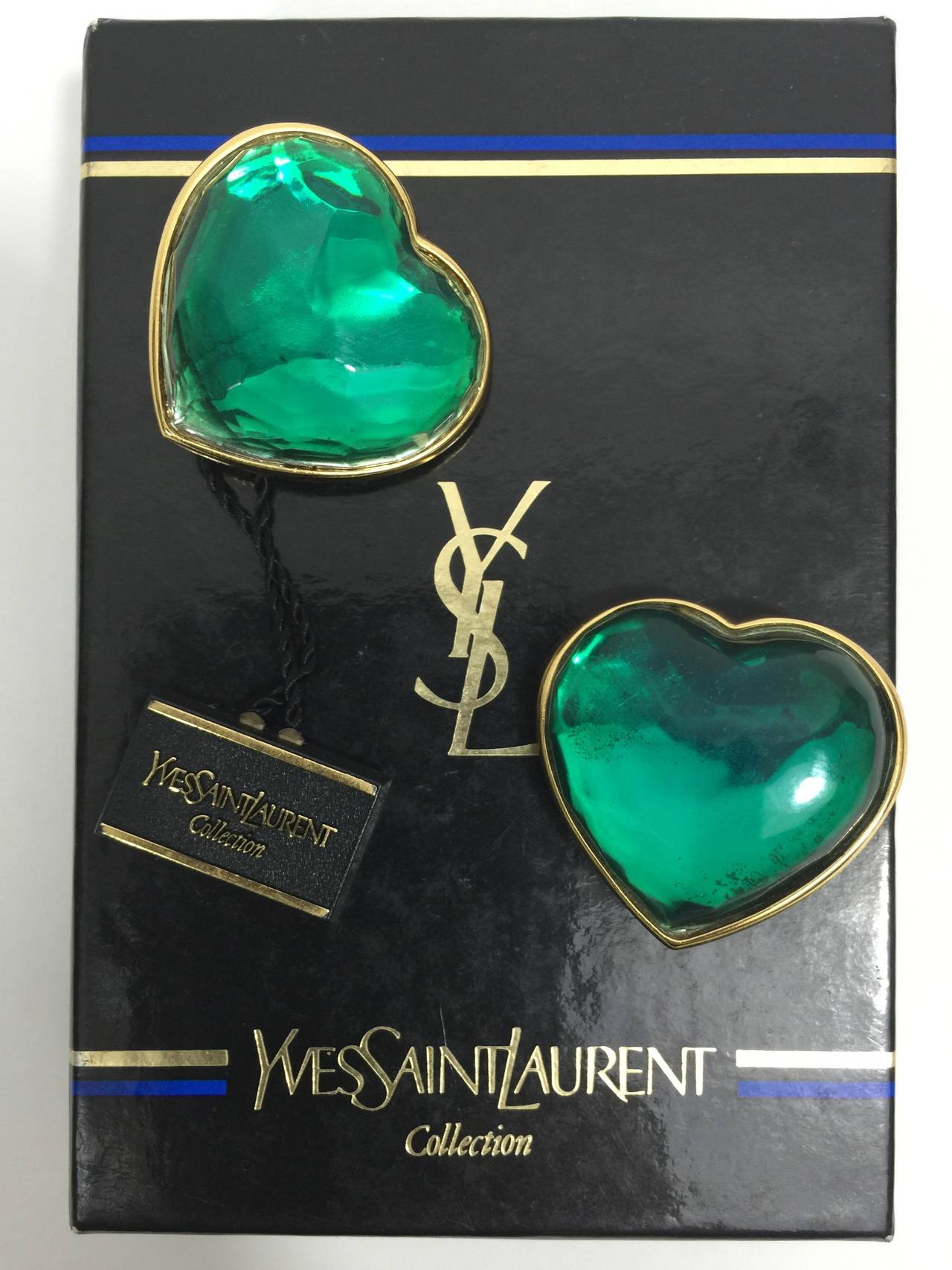 A pair of Yves Saint Laurent Green heart shaped earrings. 
Clip On. 
From 1984 and seen on the runway. Like new condition with original tags and box. Beautiful.