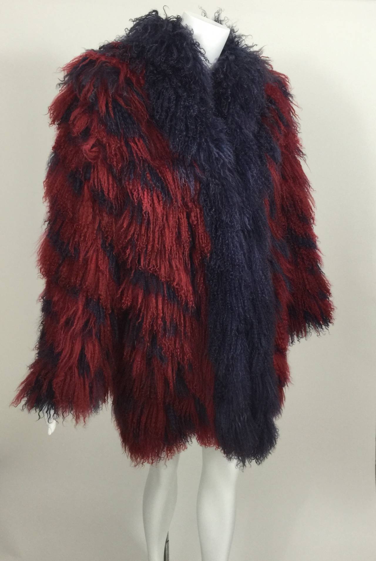 A shaggy mongolian lamb fur coat in red and purple. 
Fully lined.

Measurements:
Bust and Waist:  up to 40 inches
Length: 31 inches
Sleeve length: 24 inches
Shoulders: 18 inches