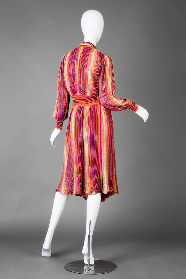This Missoni outfit with a matching fabric and beaded necklace dates back to the 1980's.
Faux wrap style top with a deep v neck
Wrap knee length skirt fastens at the top with a button
Vibrant color palette of fuchsia, purple, red and metallic