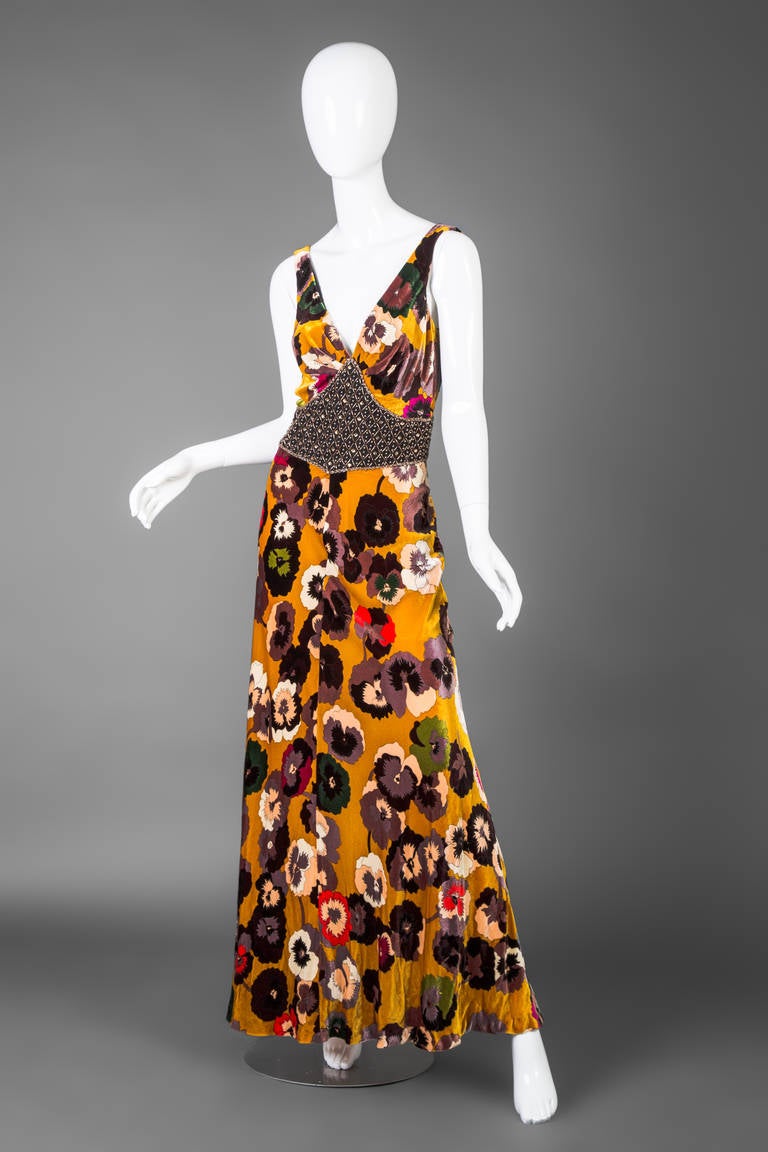 A stunning Missoni Pansy print maxi dress. Velvet with crystal embellished waist detail. Buttons in the back.

Size estimate: S/M