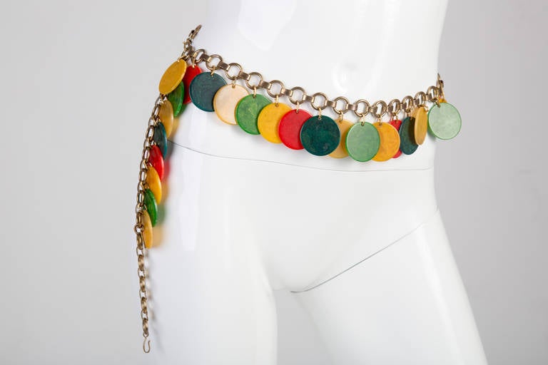 Vintage circa 1960's / 1970's bakelite disc link belt by Yves Saint Laurent. I listed it under belt, however try it as a necklace too. See the photos where I show it as a necklace. Fastens with hooks at both ends of chain and has the YSL metal hang