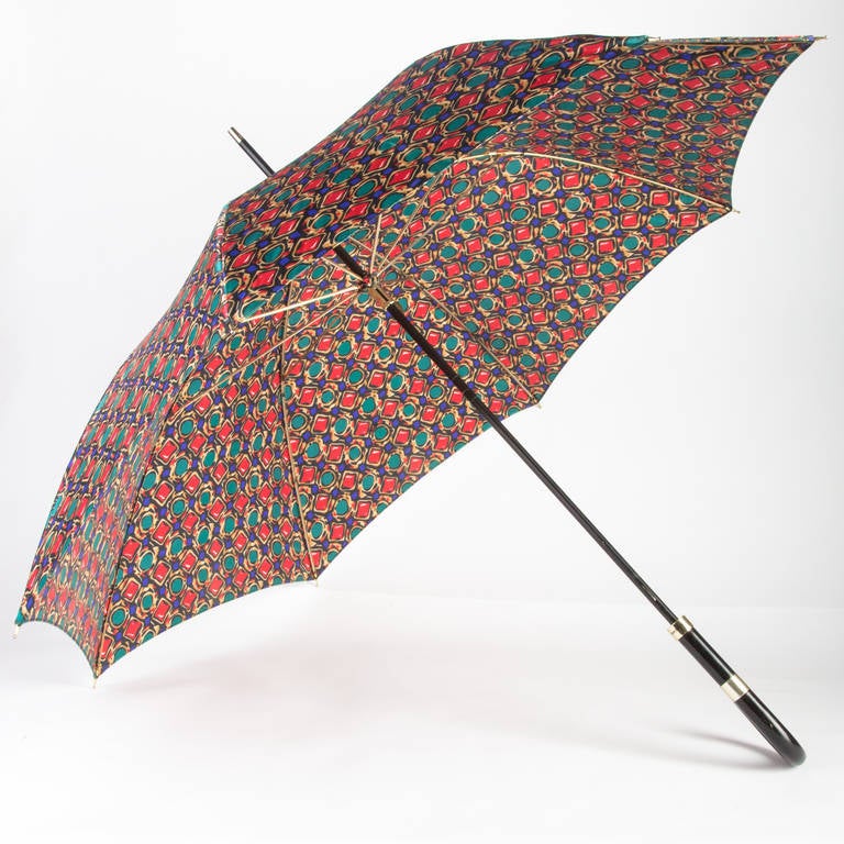 Yves Saint Laurent Umbrella done in one of his great Jewel Prints. I have had some of the vintage Saint Laurent blouses in this same print.
Add some stylish flair to a rainy day with this umbrella, or just place it in an umbrella stand, to make