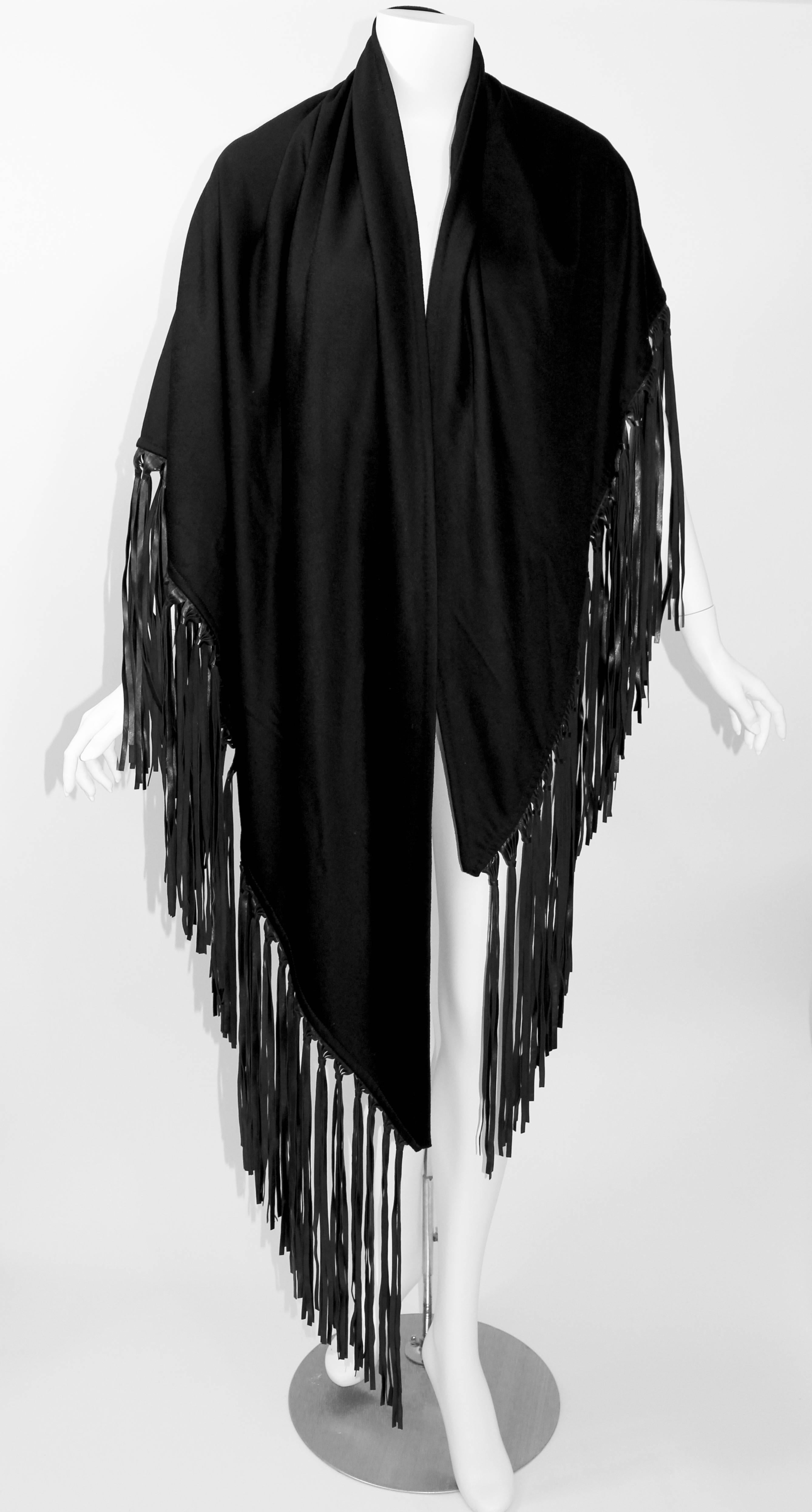 A large black Hermes vintage super soft cashmere shawl with long knotted supple leather fringe. 
Triangle shape.
Excellent condition. 
This is Hermes, label was lost in dry cleaning. 

Excellent condition. 

Measurements:
Widest part top of