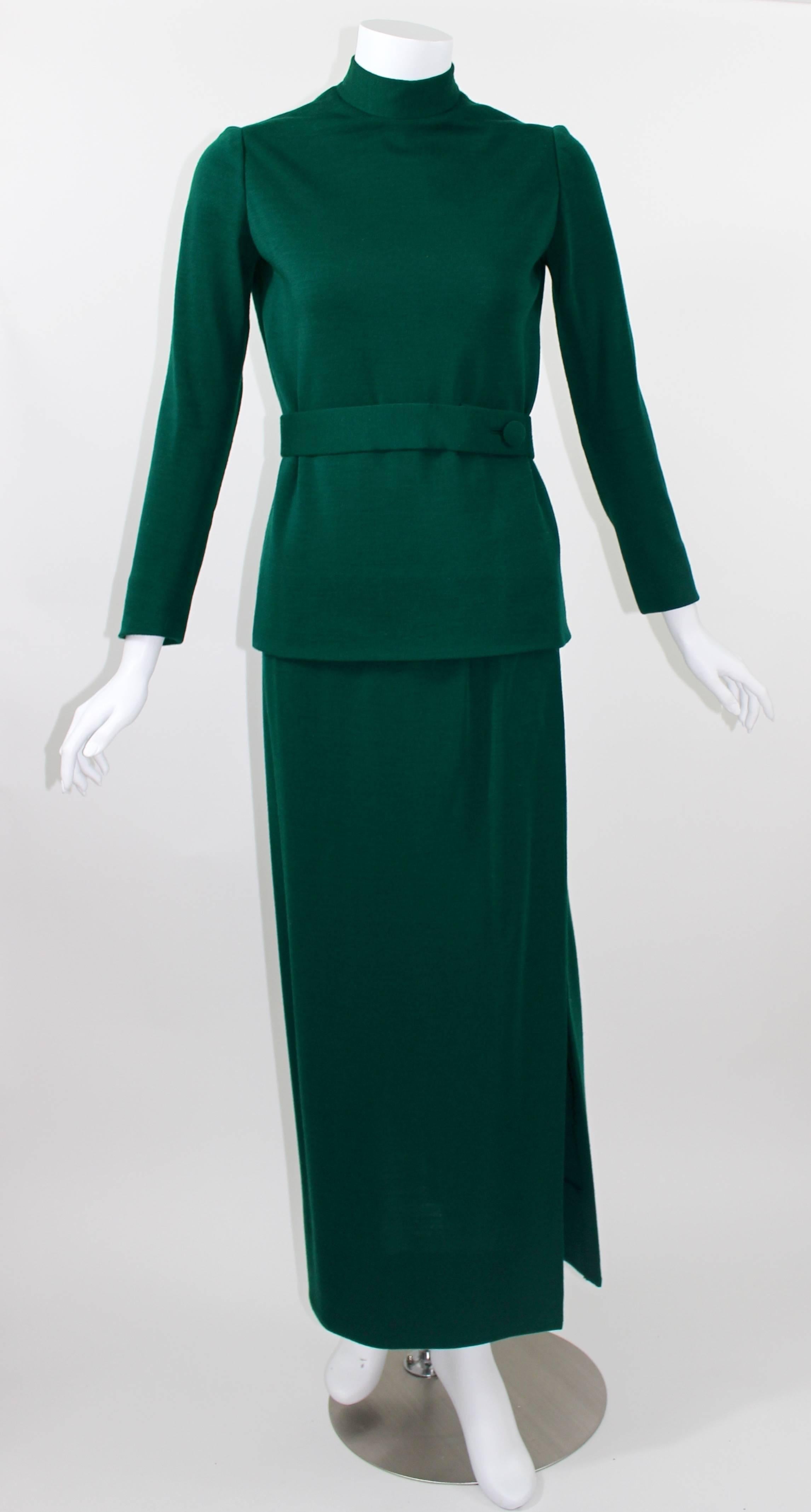 Green wool mock neck top, with a zipper back .
Matching skirt with side slit.
Excellent condition.

Measurements: 
Top:
shoulder to shoulder: 14.5 inches
bust: 36 inches
waist: 28 inches
length: 24 inches

Skirt: 
waist: 24.5 inches
hips: 34
length: