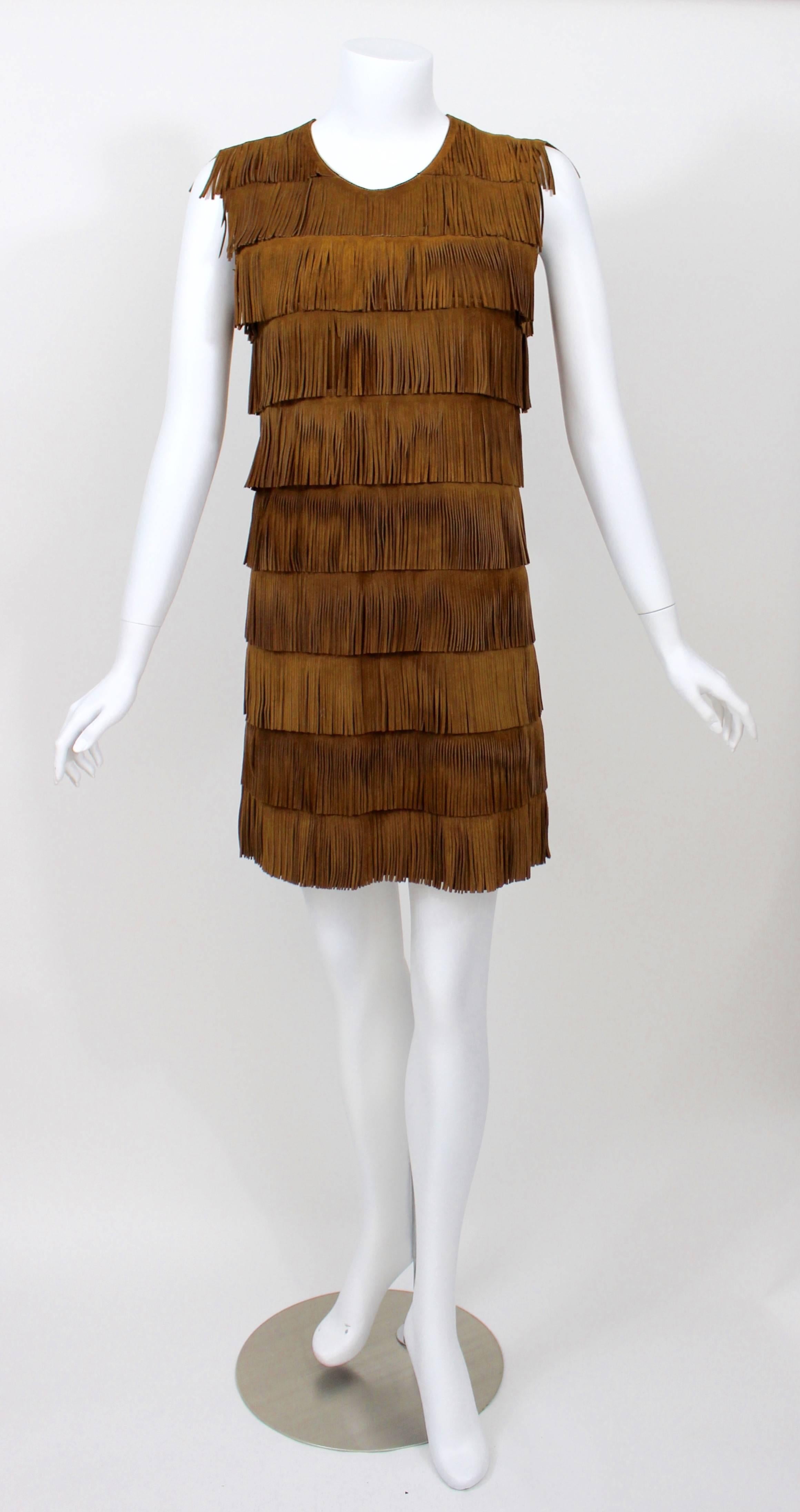 A Prada brown suede fringe shift dress.

Measurements:
Bust: 32 inches
Waist: 30 inches
hips: 34 inches
Length: 34 inches.
