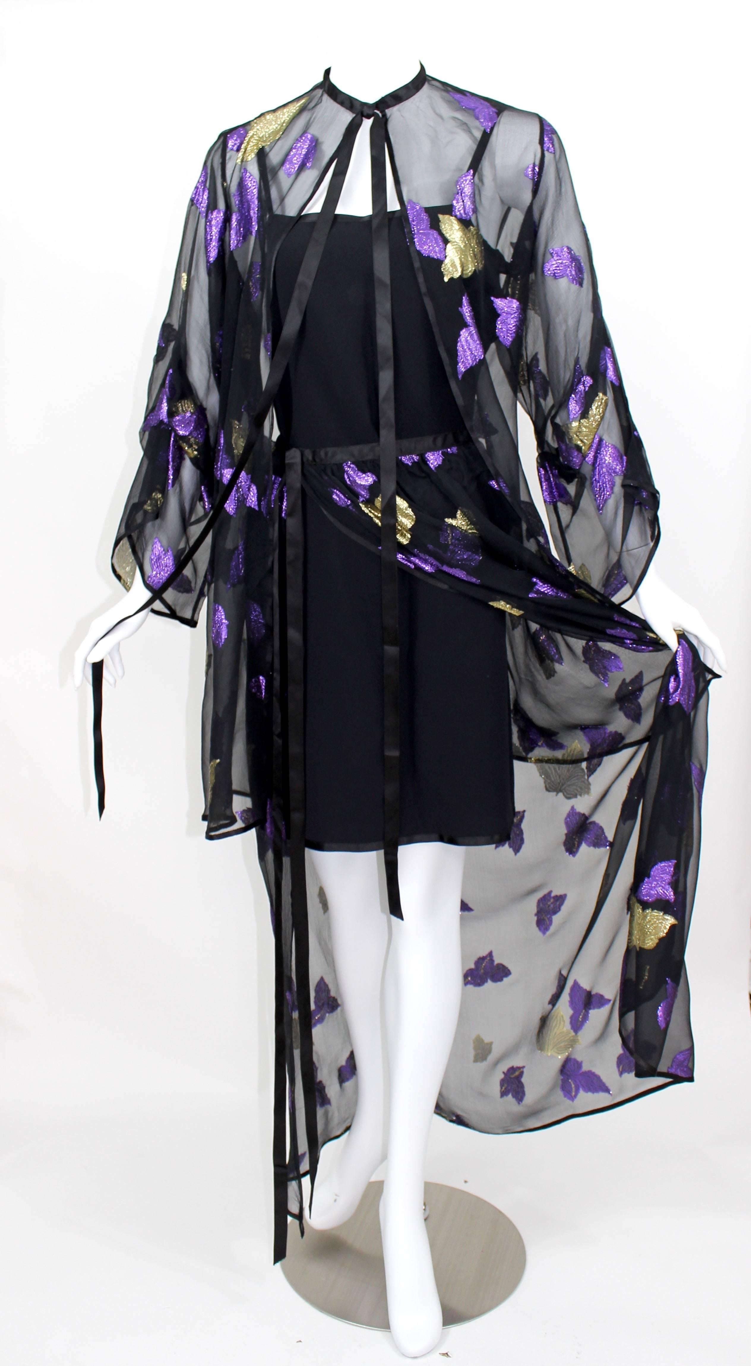 A documented vintage Saint Laurent sheer silk ensemble with gold and metallic purple falling leaves. 
The top is  trimmed in silk satin ribbon, that can be tied around the neckline.
The skirt closes at the top with long silk satin ribbons.
The under