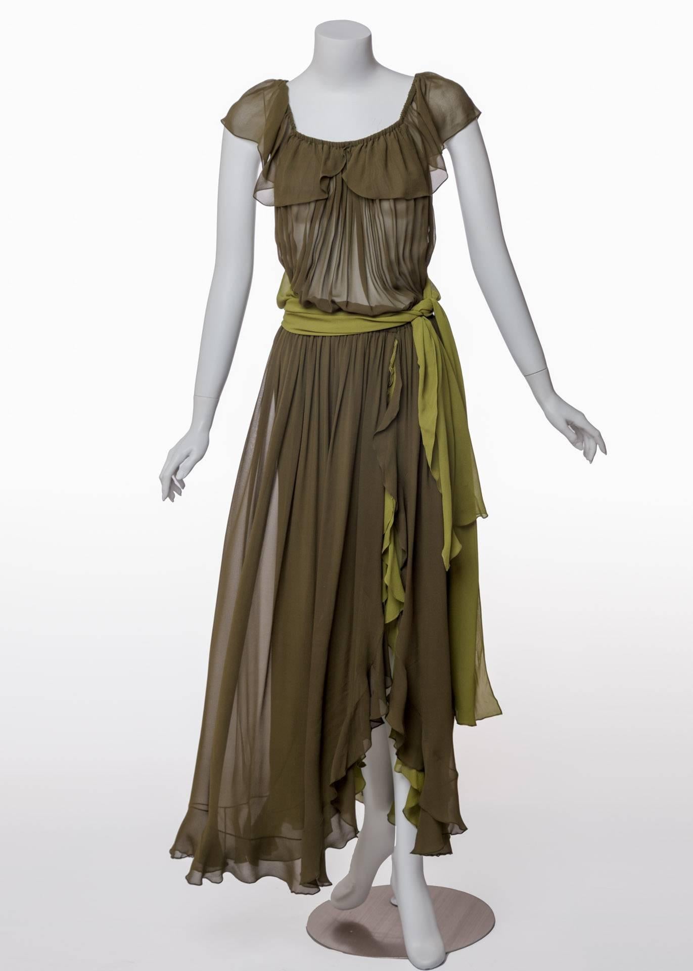 A swirl of romantic ruffles in two hues of gorgeous green silk chiffon makes this Yves Saint Laurent evening gown an ultra-pretty find from the past. Soft and flowing, the dress is embellished by a deep flounce that trims the scooped neckline, side