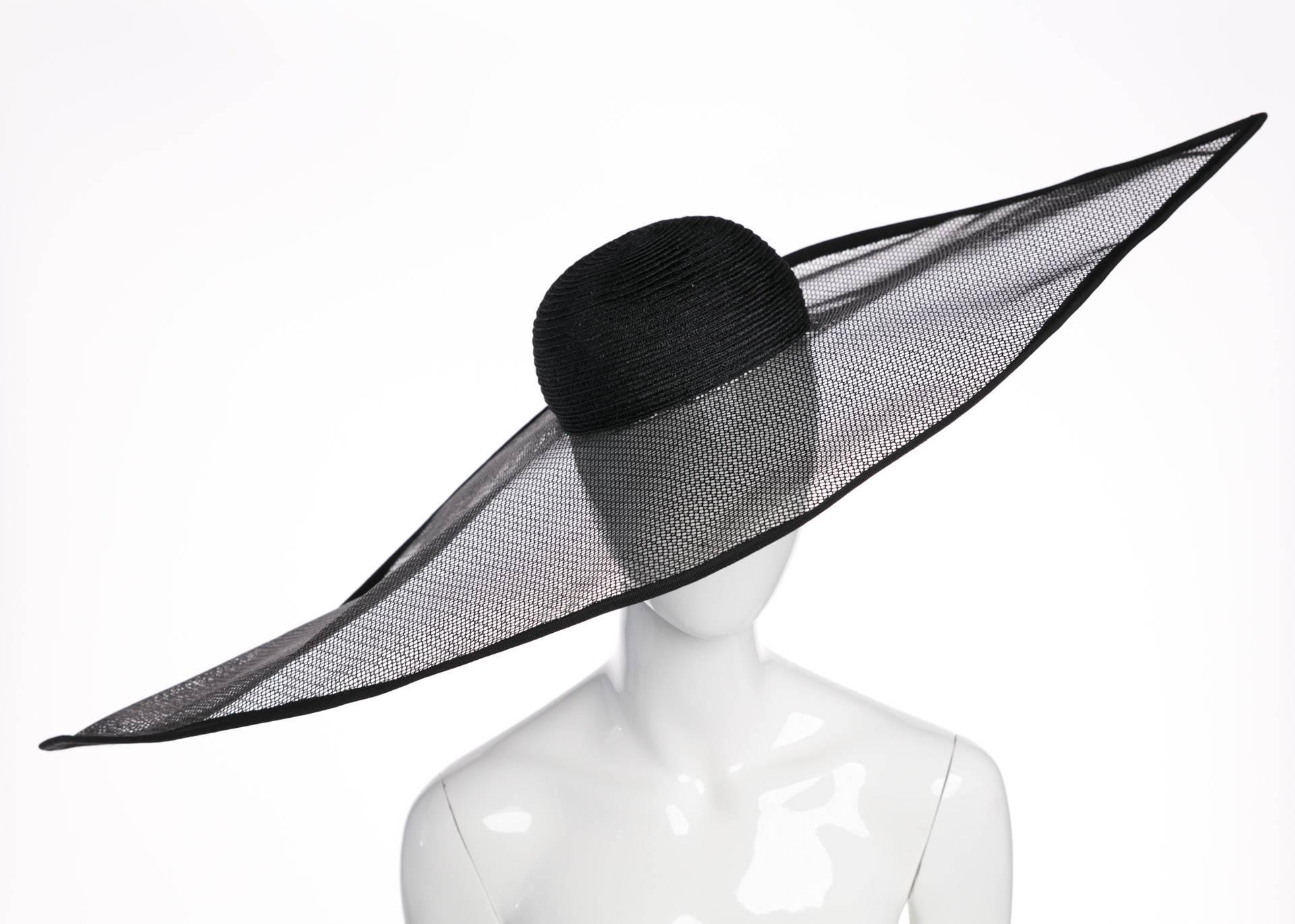 This hat cannot help but evoke the vivid millinery displayed during royal events in Great Britain. Renowned Italian designer Giorgio Armani brings the same sophistication to this hat that he brings to his clothing design. Featuring dyed black sisal,