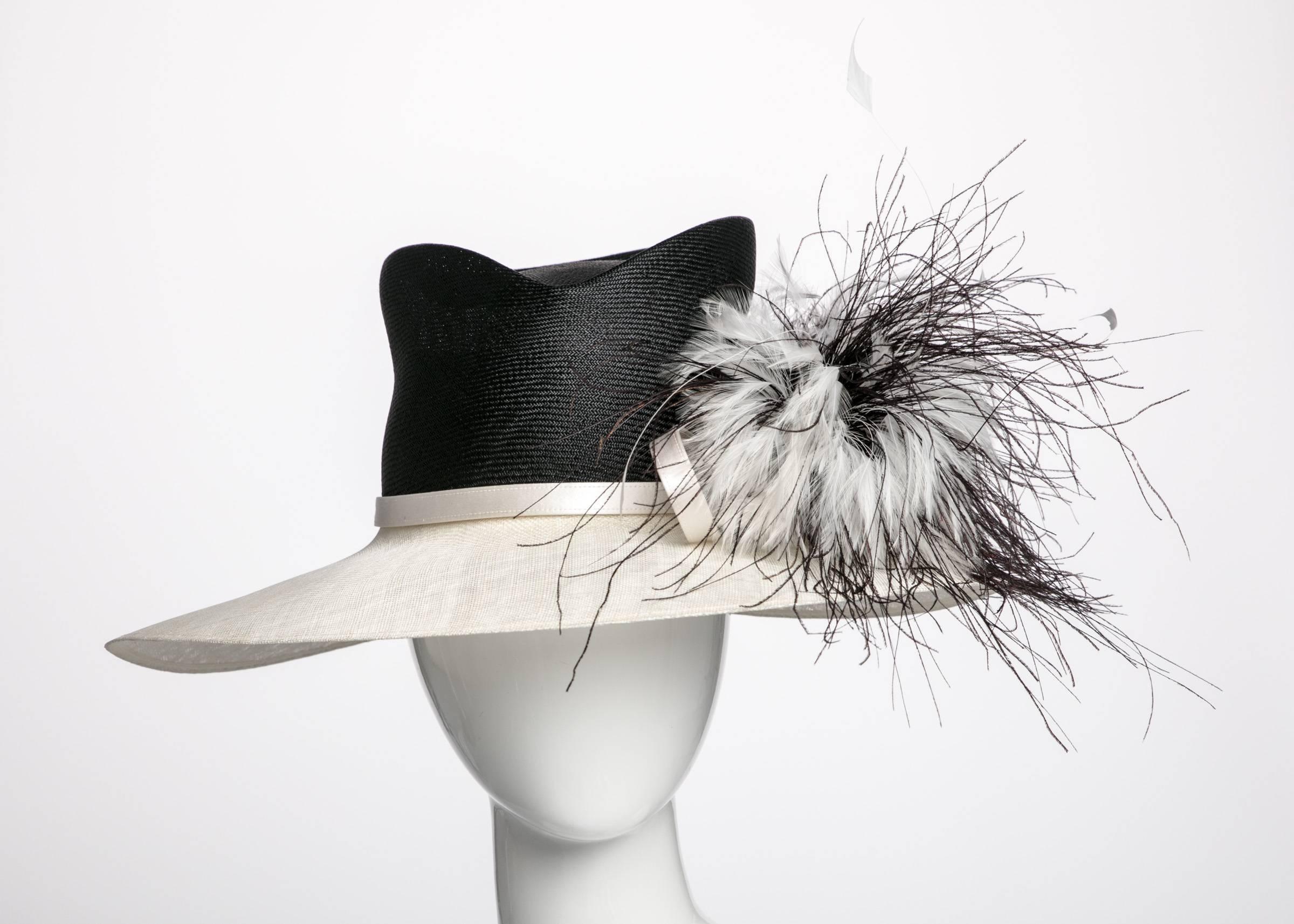 Irish born designer Philip Treacy gravitated towards millinery from an early age. During a July 6, 1990 interview for WWD, the 23 year old designer observed that “In some cases the clothes are actually the accessory to the hat.” This c2003 piece