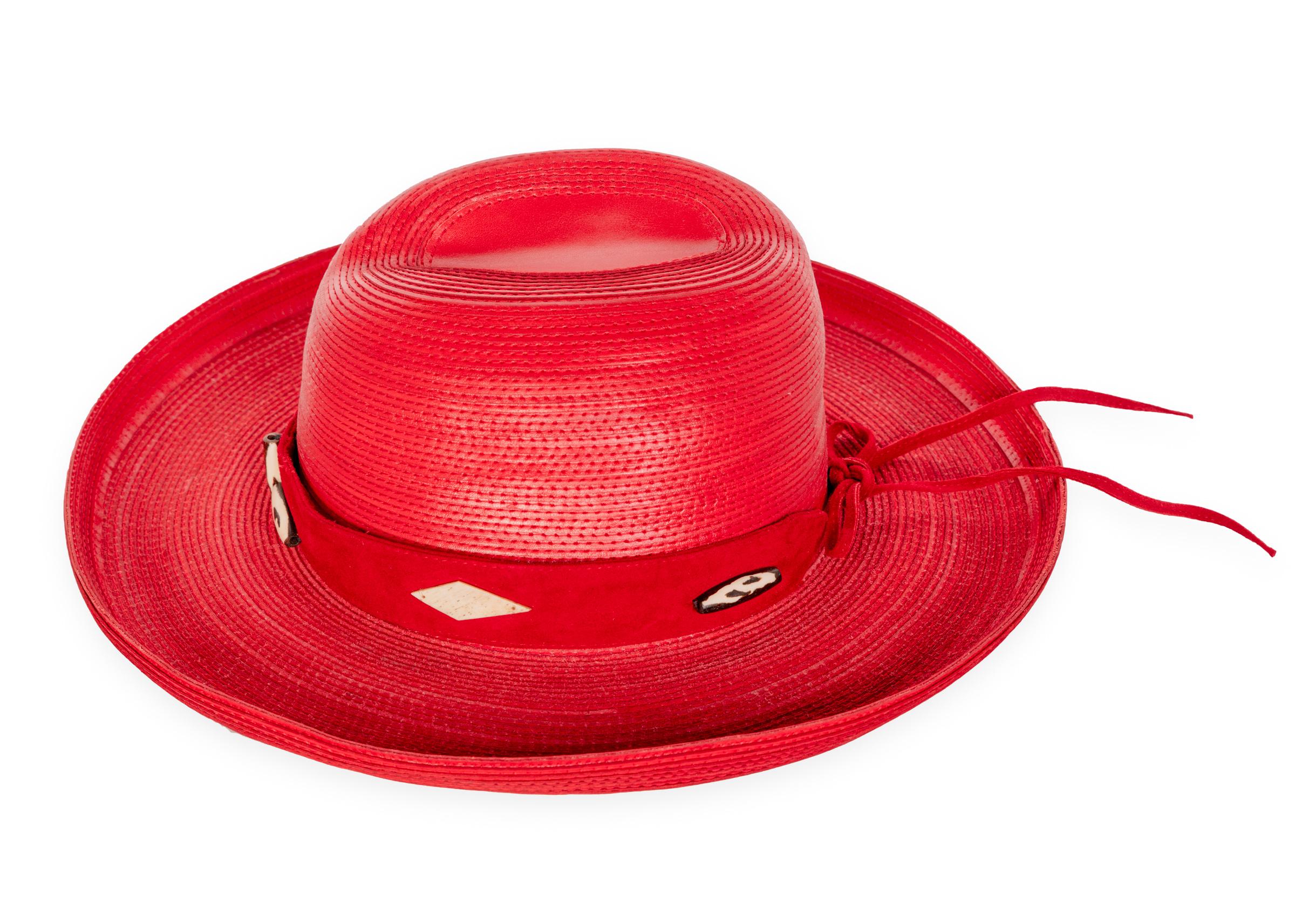 1980s Patricia Underwood red leather hat, with detachable suede hat band embellished with beads. 
Excellent condition.

Measurements:
Brim: 3.5 inches
Crown height: 4 3/4 inches
Circumference: 22 inches