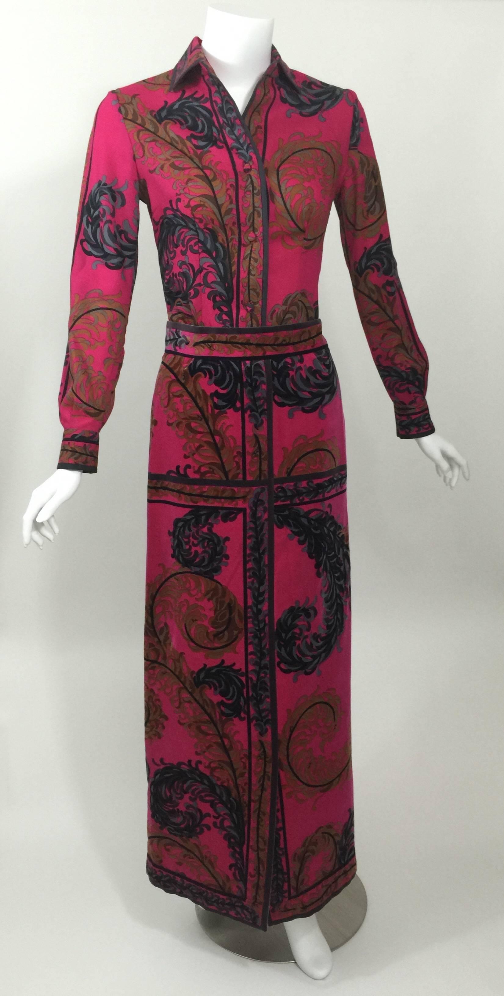 A Fabulous feather printed Pucci Outfit. Loving the color combination. of  the bright Fuschia background with the print in blues, black and gold.
The Blouse is a lightweight wool, with covered buttons,and side slits. The skirt is cotton velvet and