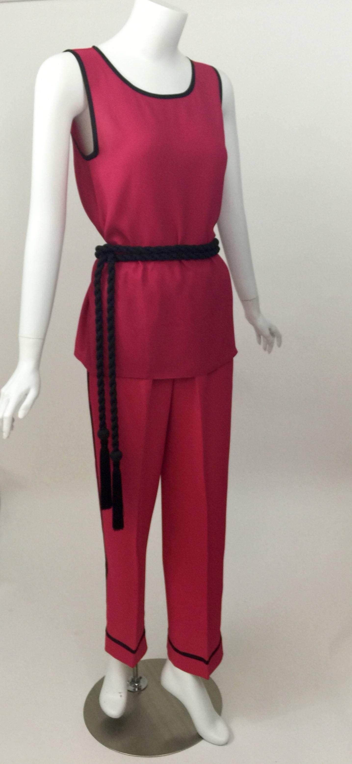 This is a super chic three piece set from Saint Laurent.
The color is shocking pink, and I love the subtle Two-Tone color. The top is a deeper shade of pink and the pants are a slightly brighter tone. 
The fabric is a lightweight crepe.

The top