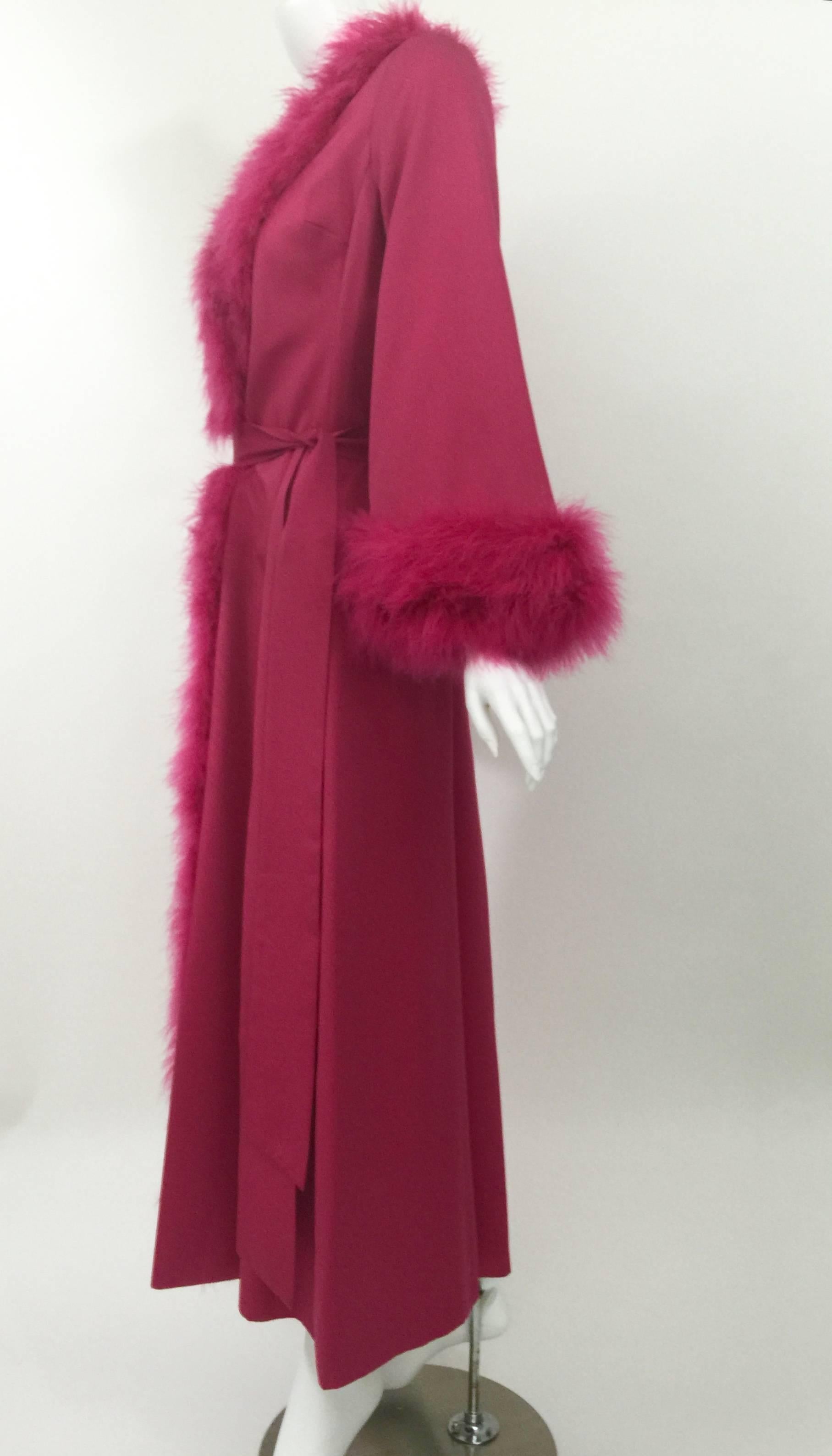 This is such a fabulous piece. Vintage from the 1980's. 
The magenta color with the thick marabou trim brings to mind old Hollywood glamour. 
In excellent condition. Fully lined. Closes with the matching sash.
 
Measurements:
Shoulders: