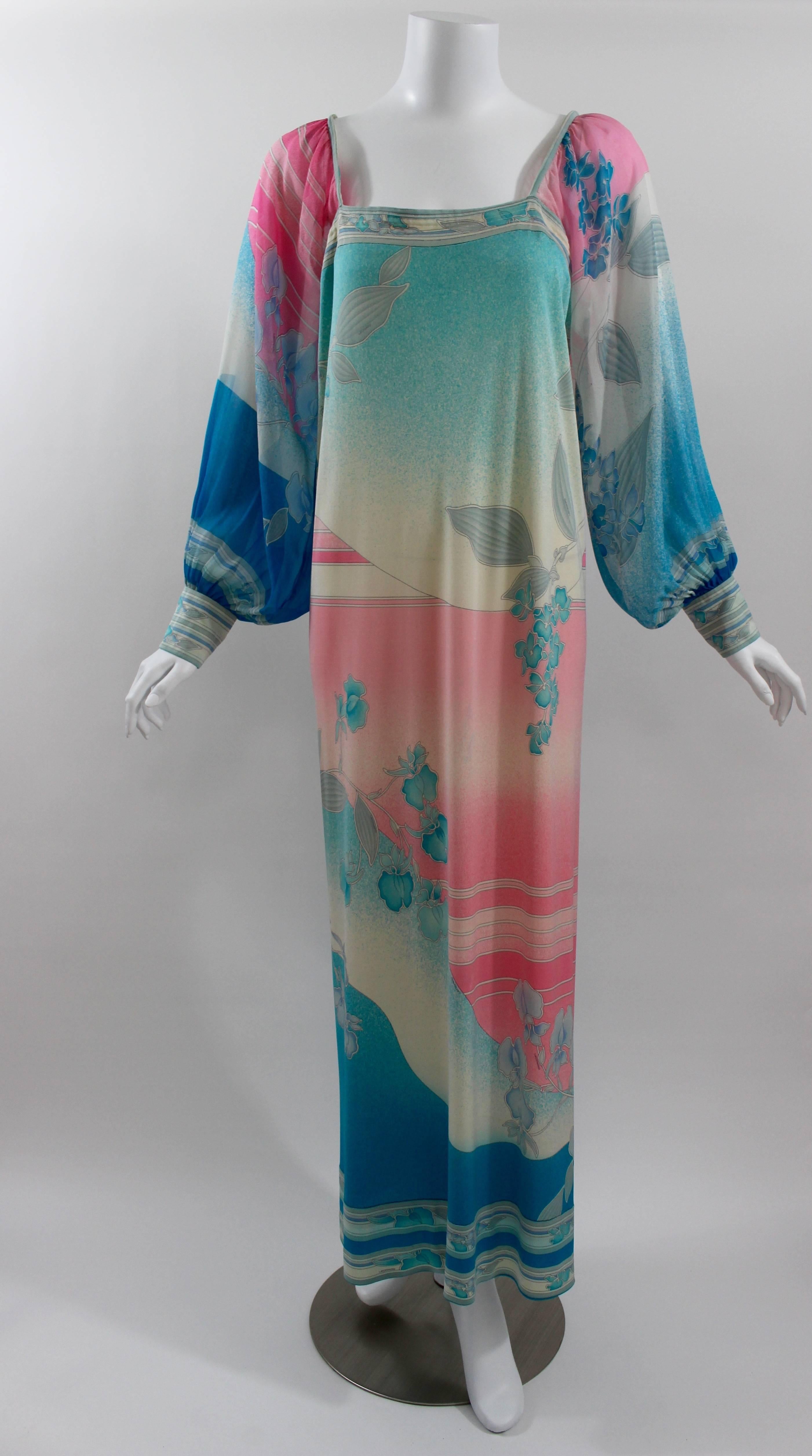 A beautiful Leonard Paris dress from the early 1970s.
The body is a luxurious silk jersey, and the full billowy sleeves in sheer silk chiffon with jersey buttoned cuffs. 
A square neckline front and back.
Slips over the head and unlined. 

This