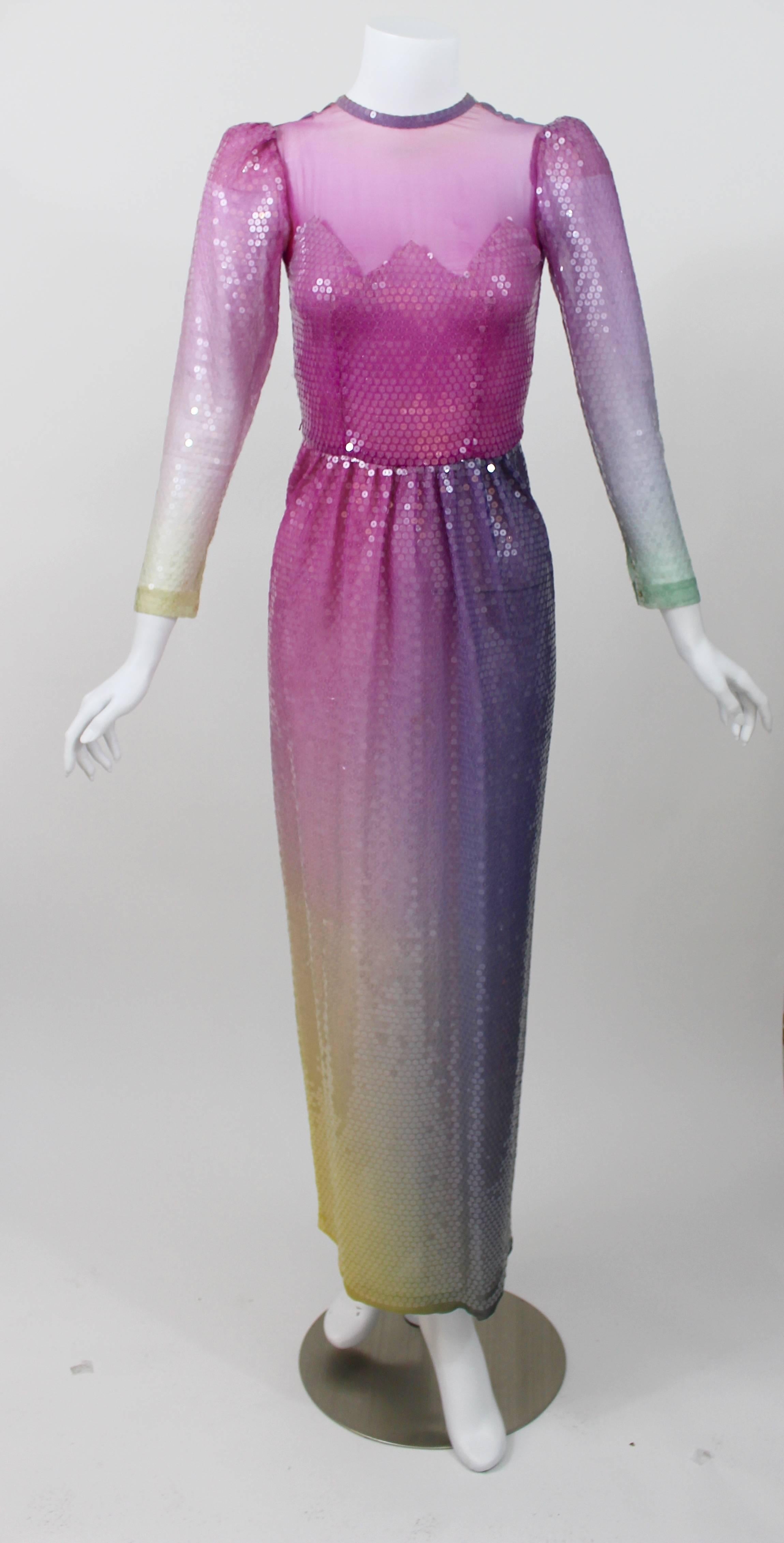 This is a custom couture  gown made for my client in the 1980s.

A magnificent  confection of an evening gown. A  romantic deep hombre pastel sunset of color, offset with a sheer overlay of glistening clear sequins.
An Illusion feminine bodice
