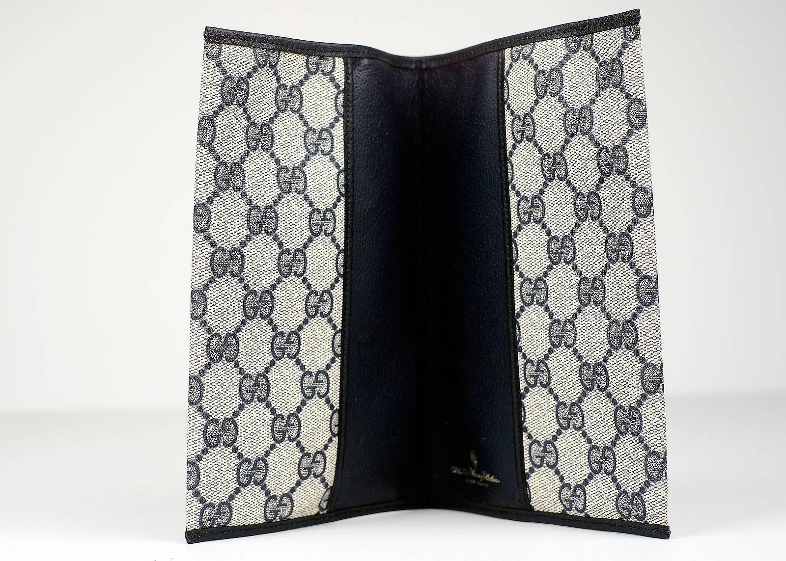 Gucci Anniversary Collection white and black double G patterned TV guide holder. 

Measurements: 7.5 inches long, 5 inches wide

-Measurements-
length: 7.5"
height: 5"

Good Vintage Condition:Please remember all clothes are previously