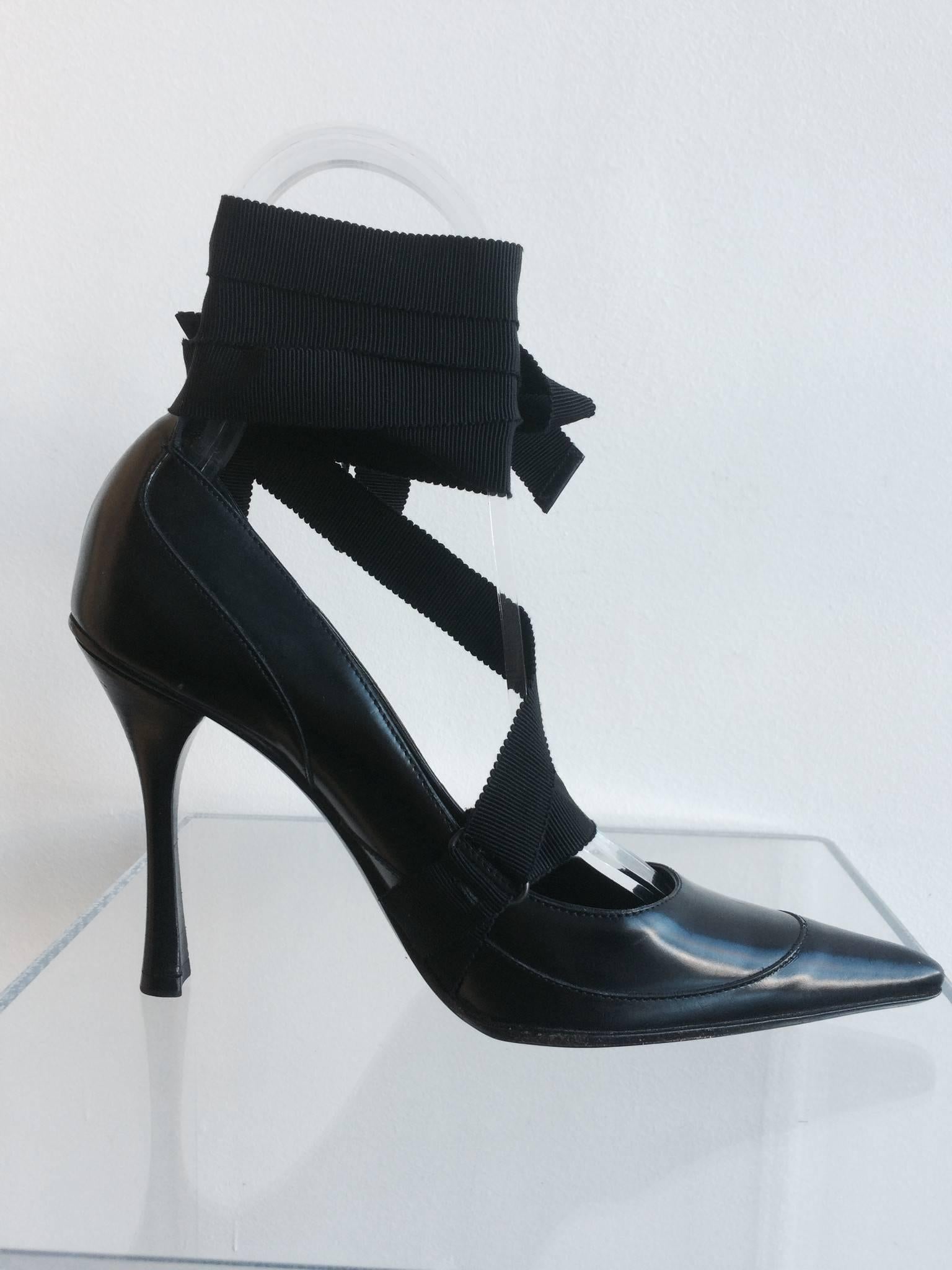 Gucci pointed Winklepicker black leather pumps with ribbon fastener.

Size Marked:  7B
Heel Height: 4