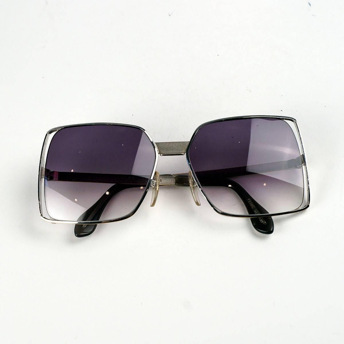 Silver Neostyle square frame sunglasses. 

Made In Germany. 135 BOUTIQUE 380 54 16.

Measurements:
Lens- 2 inches wide, 2 inches high
Arm- 4.5 inches
Frame- 5 inches

Good Vintage Condition:Please remember all clothes are previously owned and gently